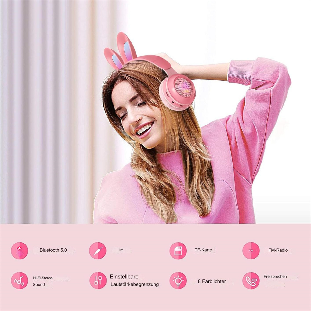 Frau mit pinken Hasenohrhörern. Pinker Pullover, lächelnd. Symbole zeigen Bluetooth, TF-Karte, UKW-Radio.