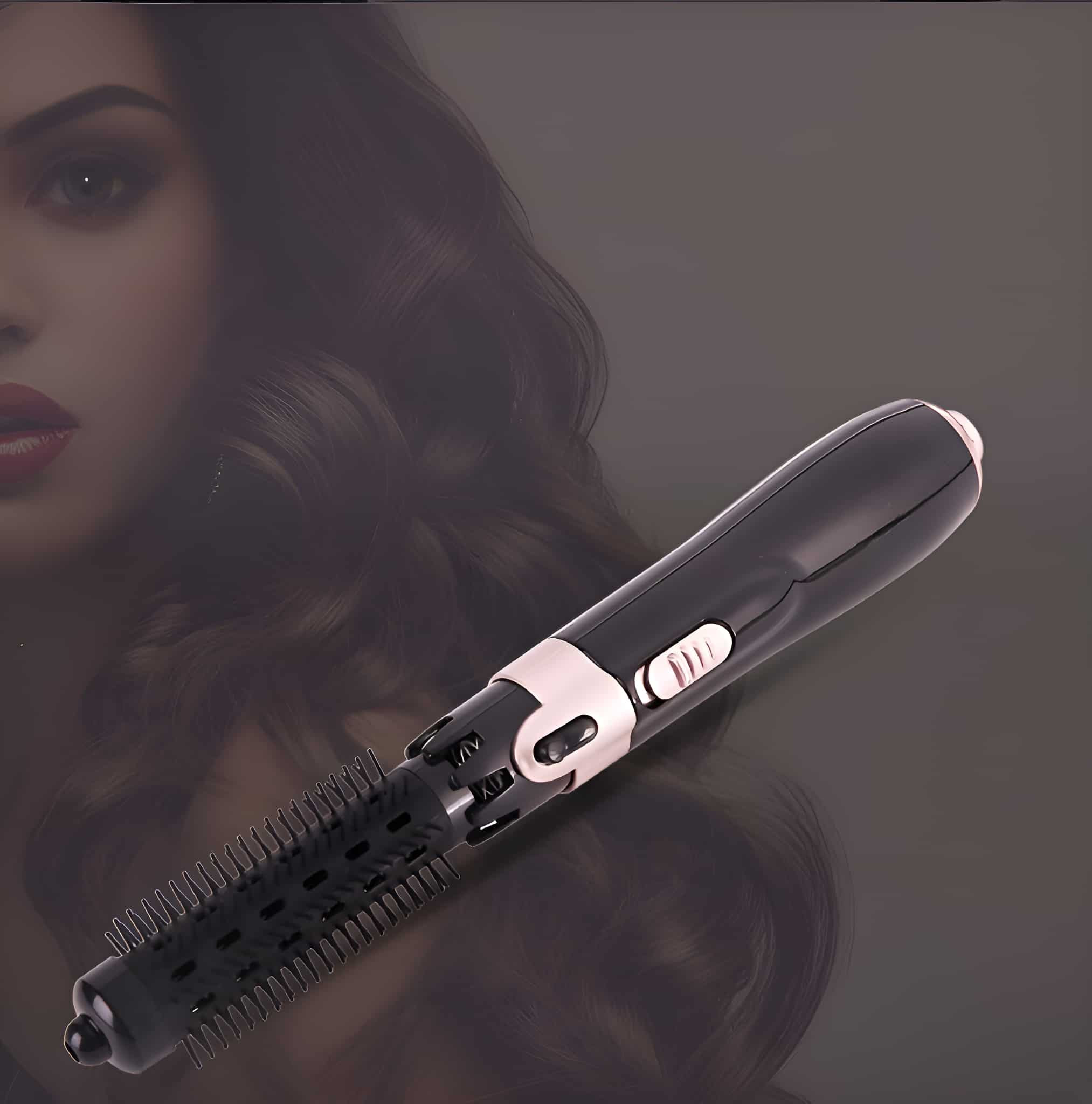 Ein schwarz-roségoldener Haarstyler. Der Hintergrund ist ein verschwommenes Bild von Frauenhaaren.