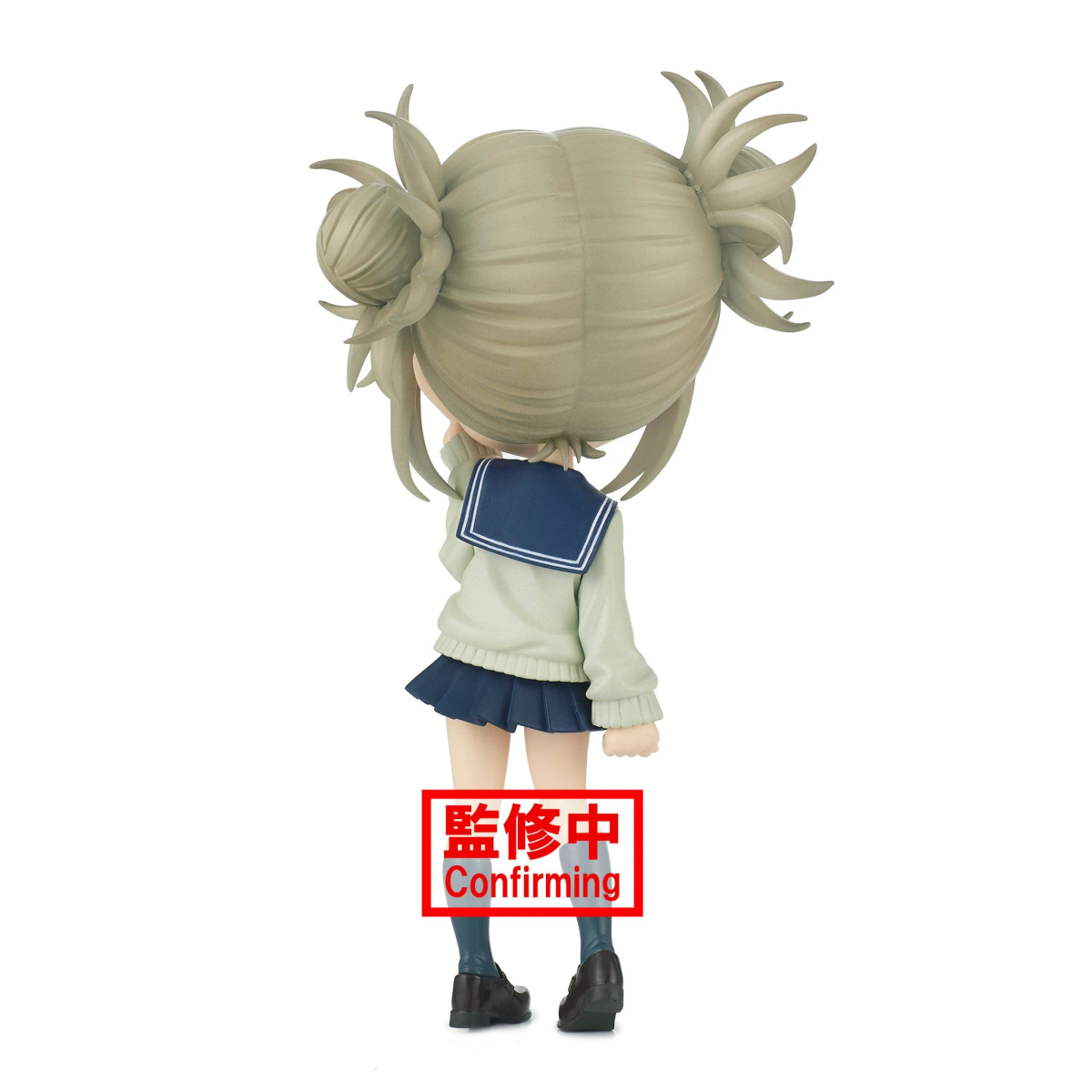 Figura de anime de una chica en uniforme escolar, vista trasera. Sello rojo: Confirmando.