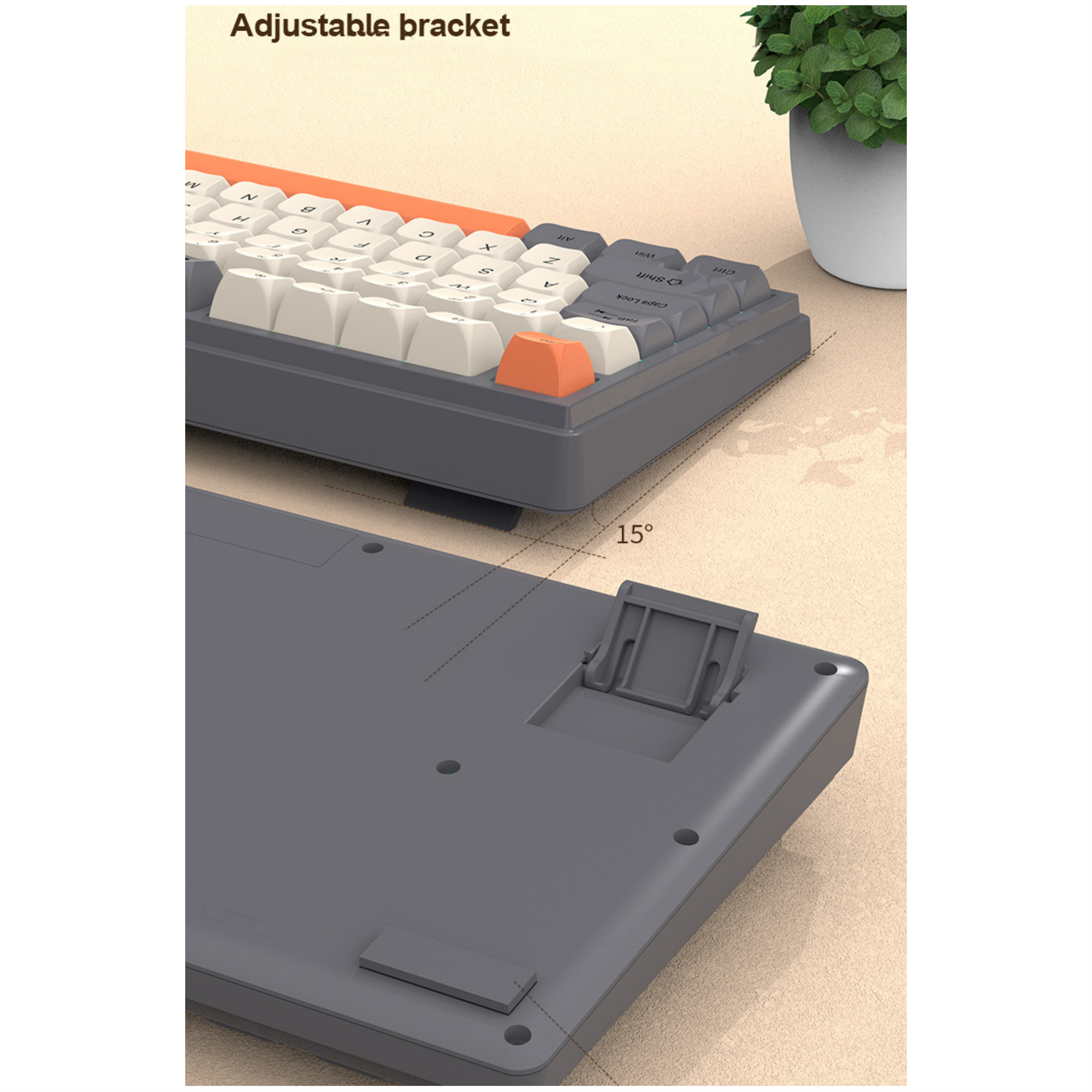 Eine graue Tastatur mit orangefarbenen Akzenten und einer verstellbaren Halterung auf der Unterseite.