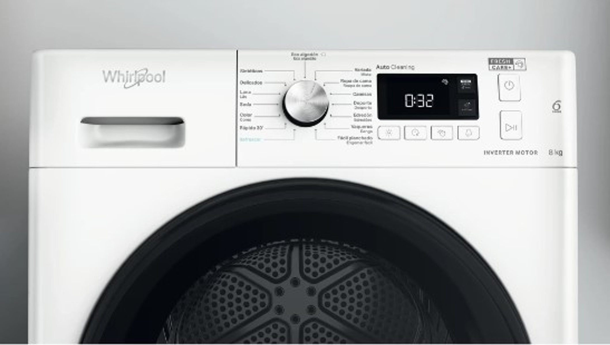 Panel de control de lavadora Whirlpool blanca. Con dial, pantalla y botones.