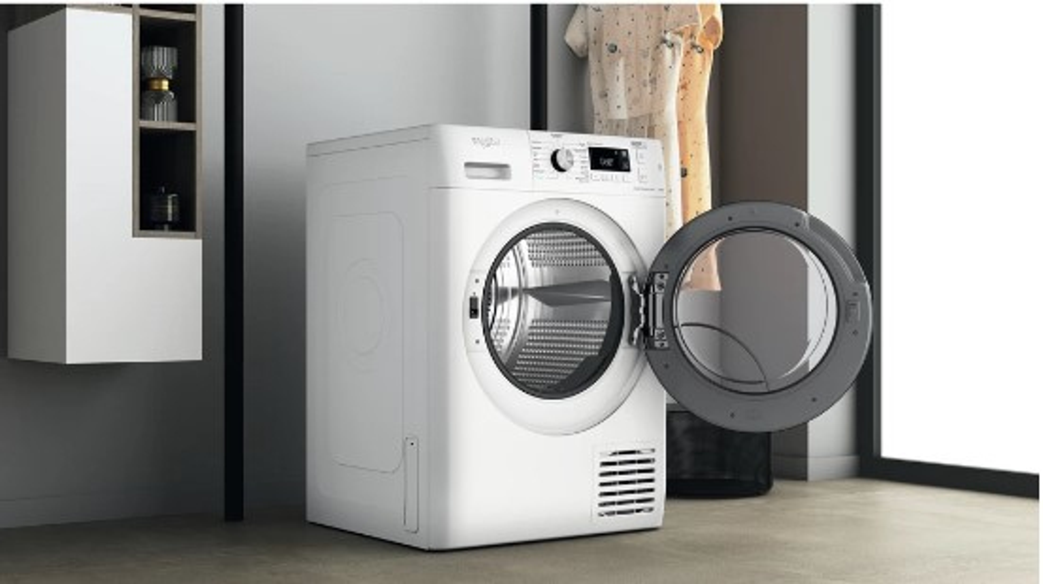 Una secadora Whirlpool blanca con la puerta abierta, en un entorno de habitación.