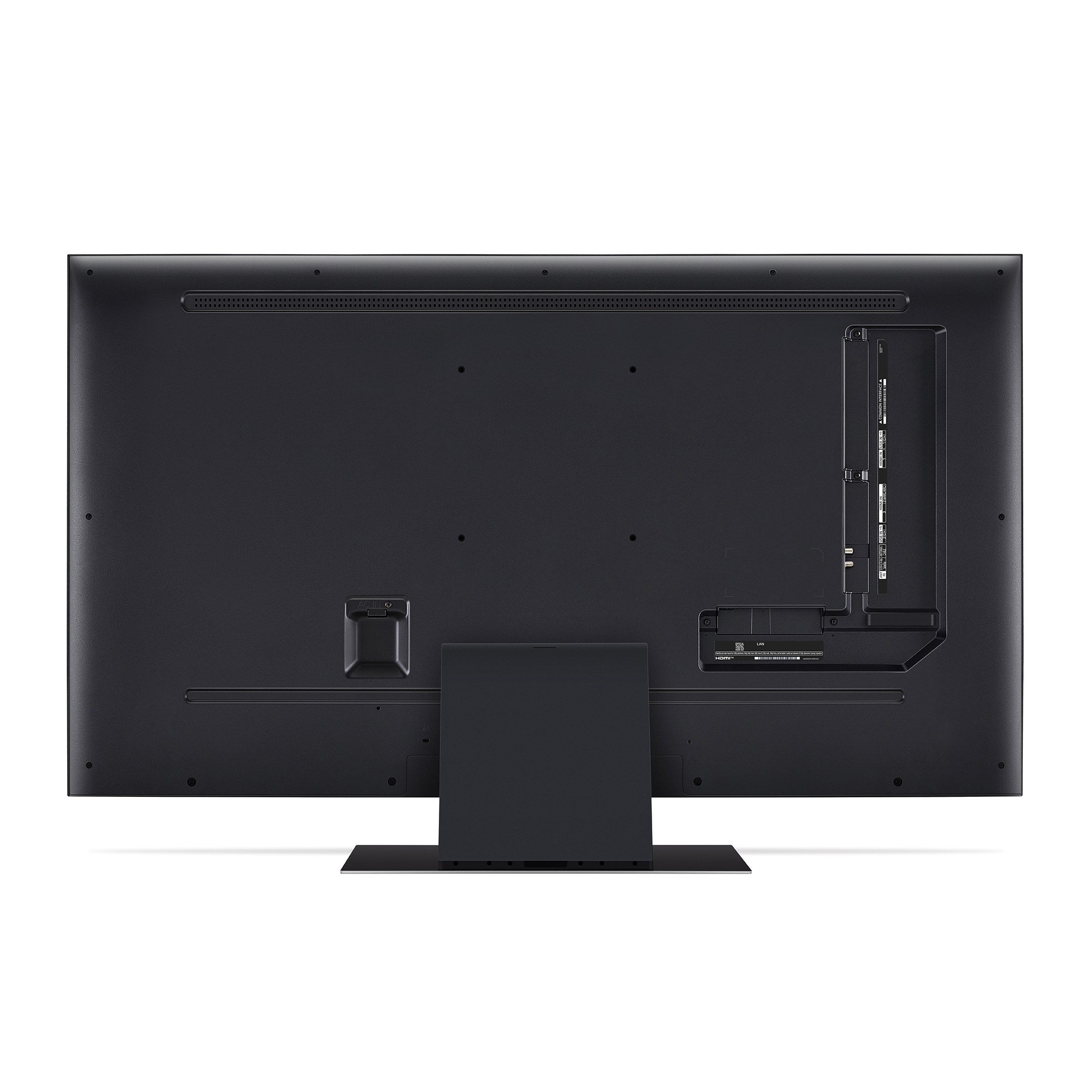 Parte trasera de un televisor negro con varios puertos y un soporte. Superficie oscura, aspecto limpio.