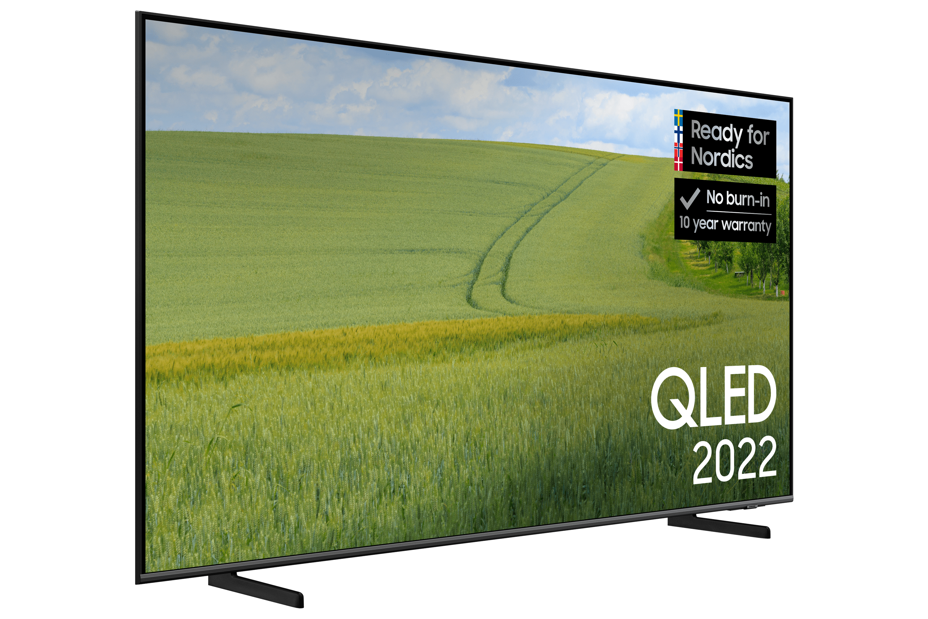 Telewizor QLED 2022, pokazujący zielone pole, niebieskie niebo i czarną podstawę.