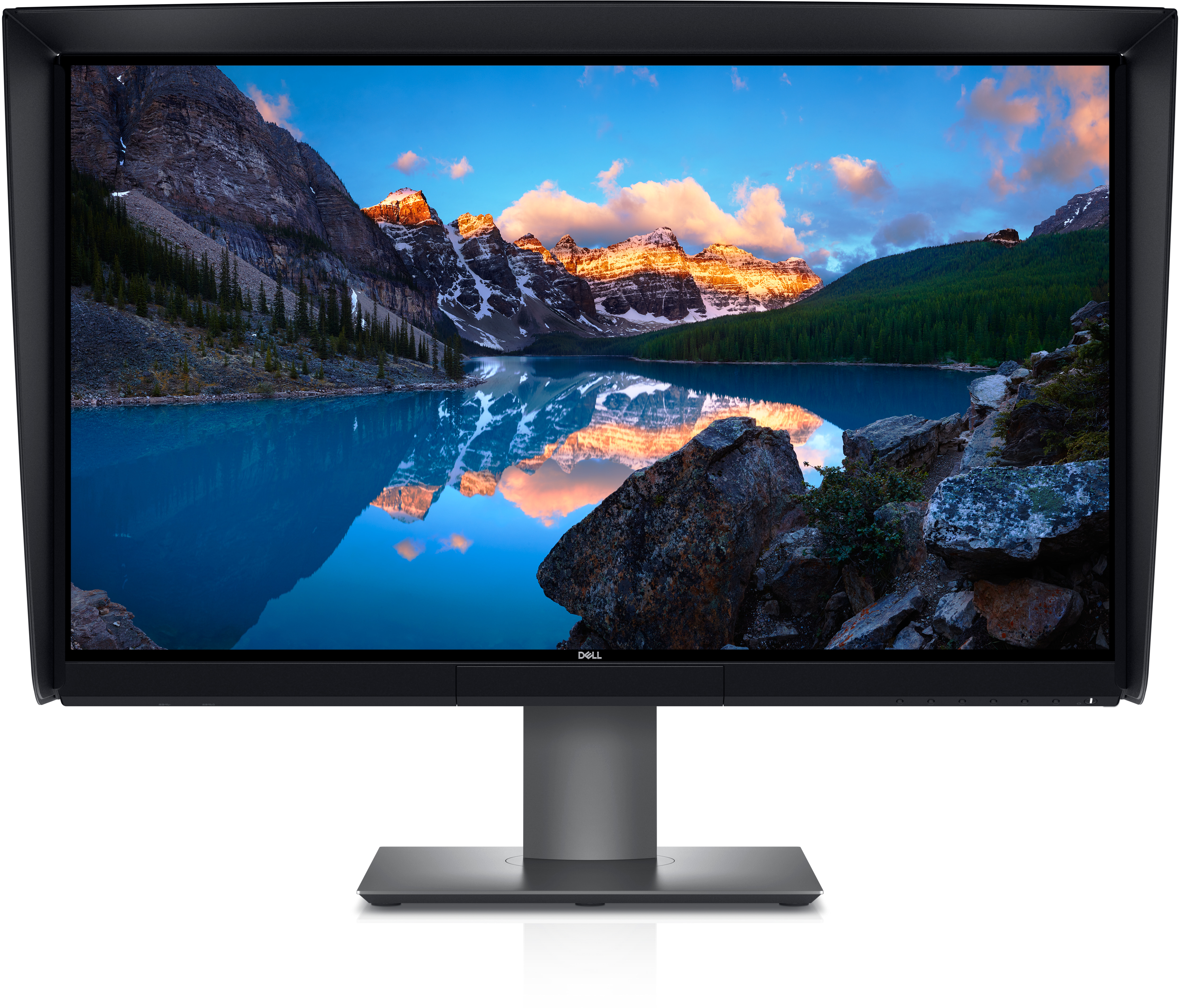 Un monitor Dell con una escena de lago de montaña en la pantalla, aislado en blanco.