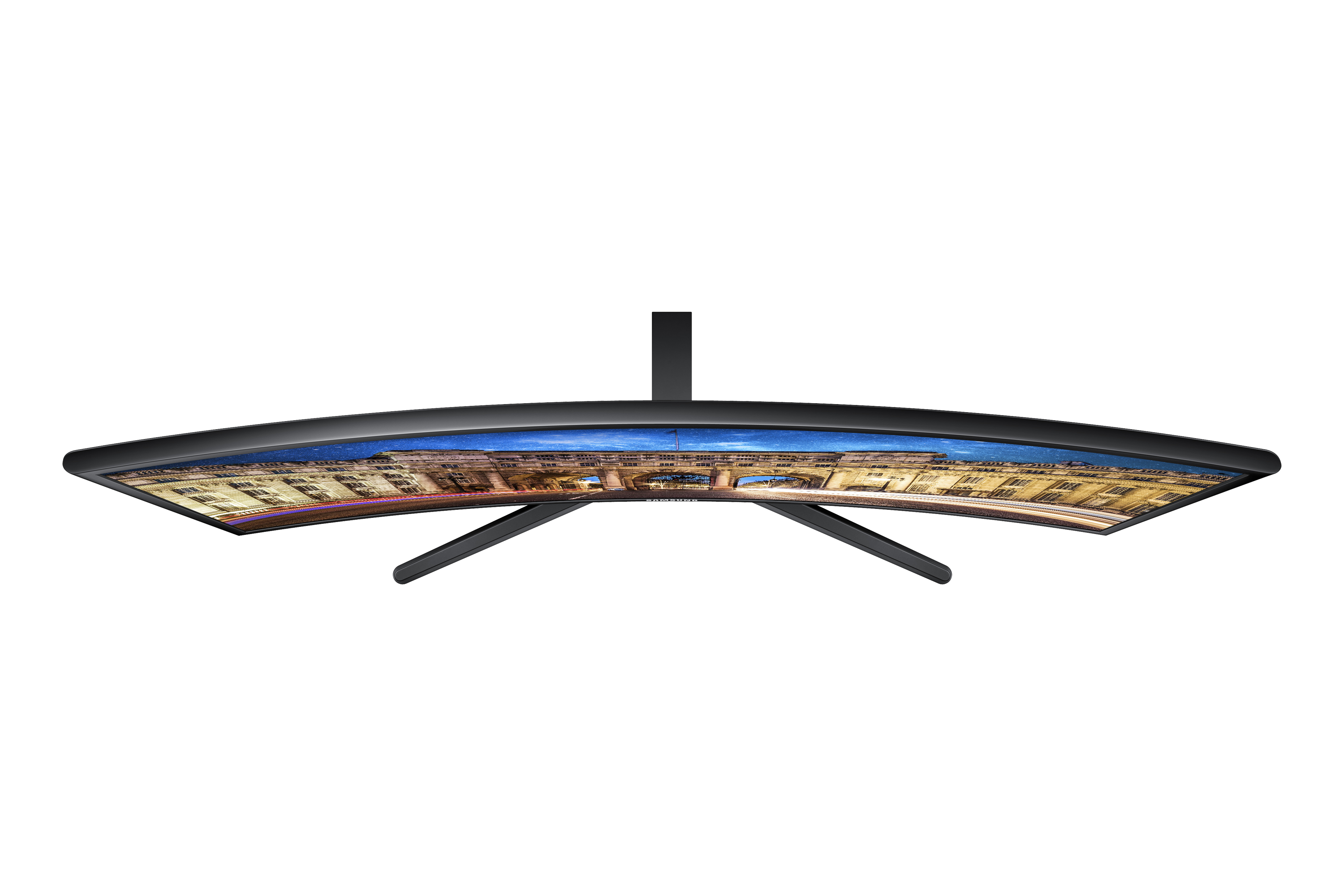 Vista dall'alto di un monitor curvo. È nero, con un paesaggio urbano visualizzato sullo schermo.