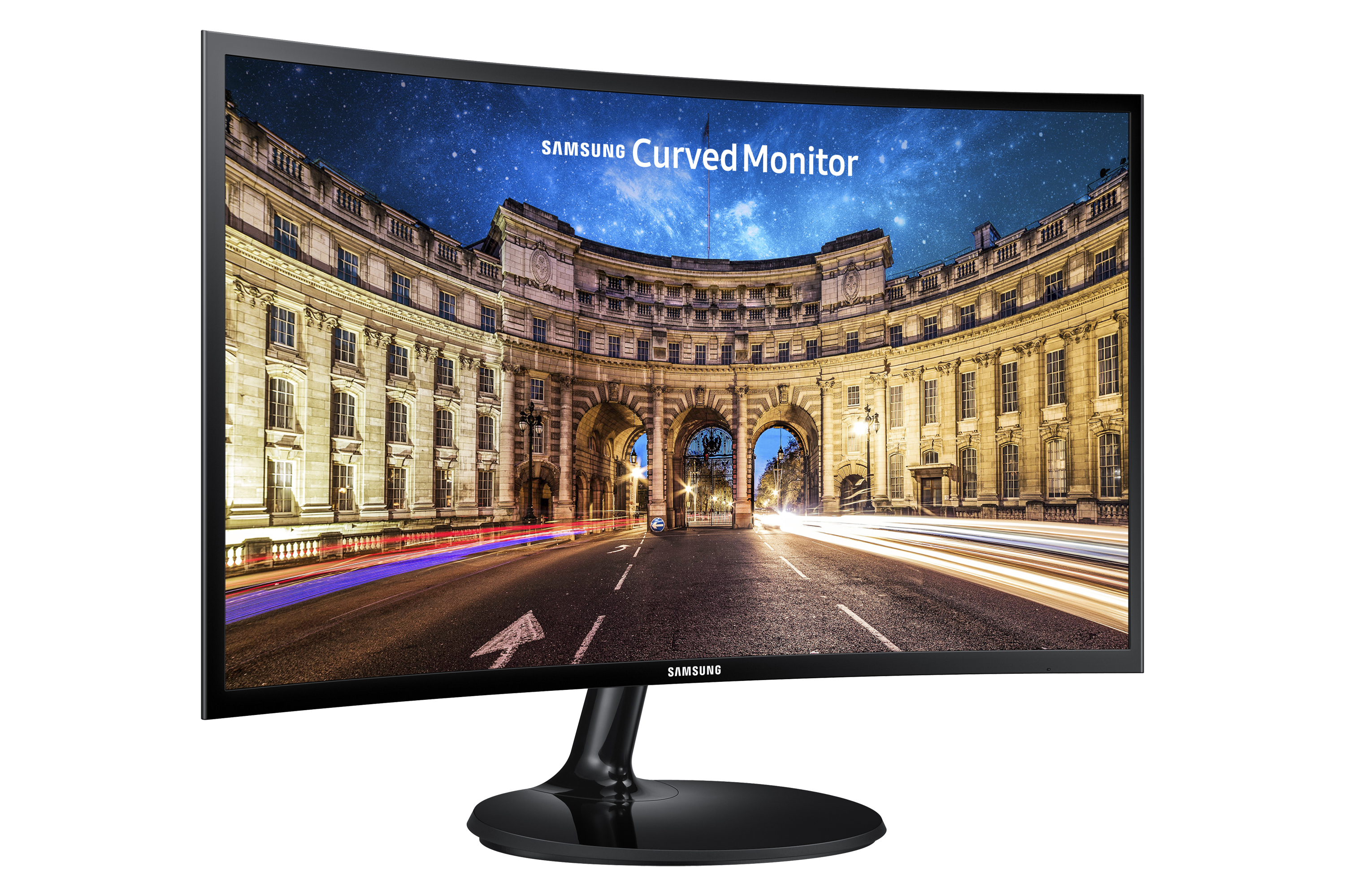 Un monitor per computer curvo che mostra una scena cittadina con edifici di notte.