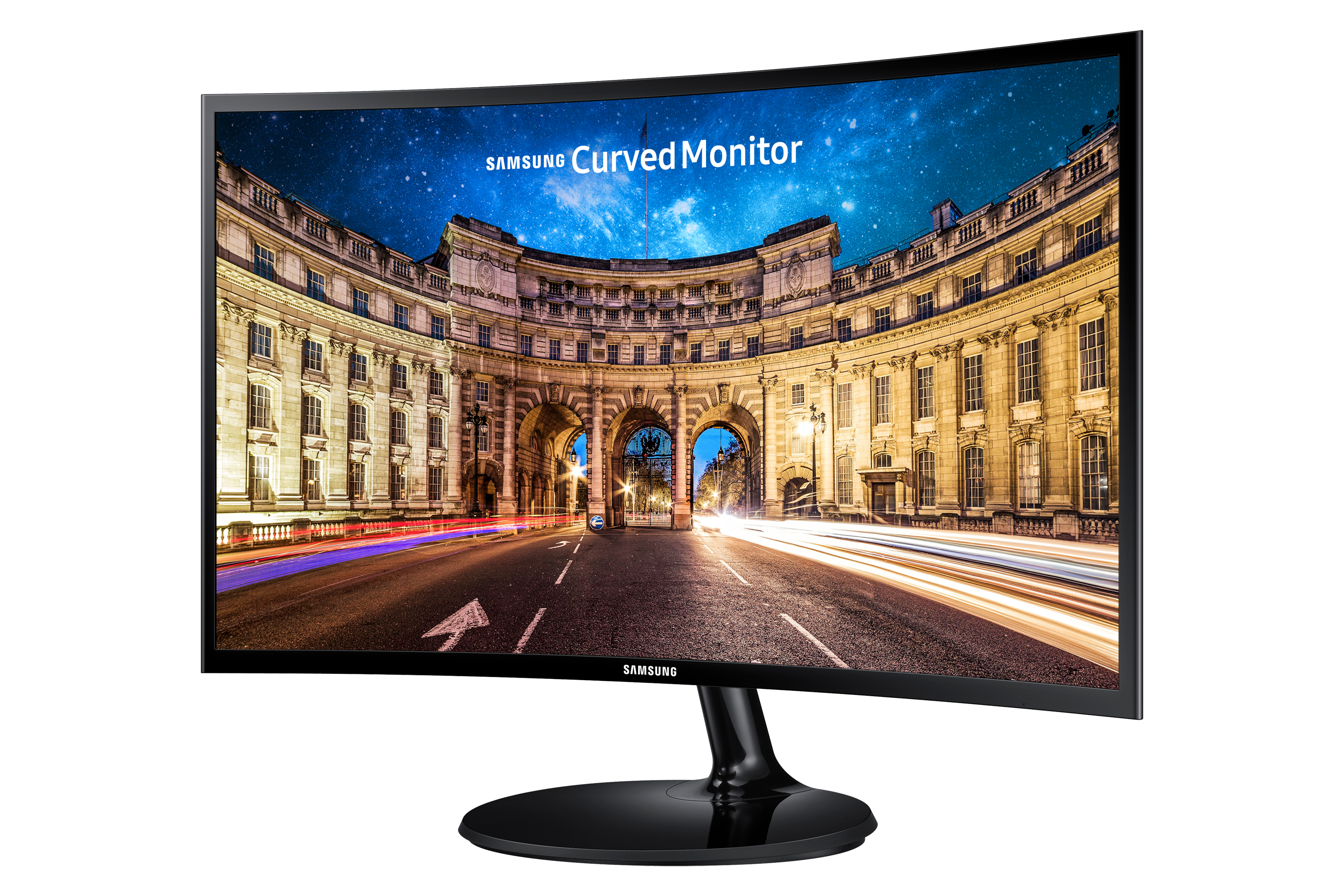 Un monitor Samsung curvo che mostra una via cittadina di notte.
