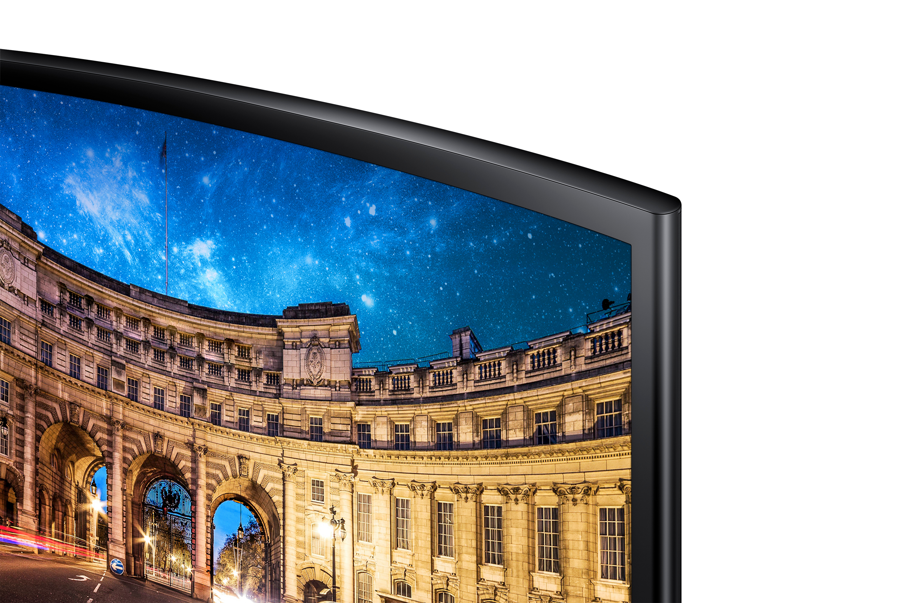 Primo piano di un monitor con cielo stellato e un edificio con archi.
