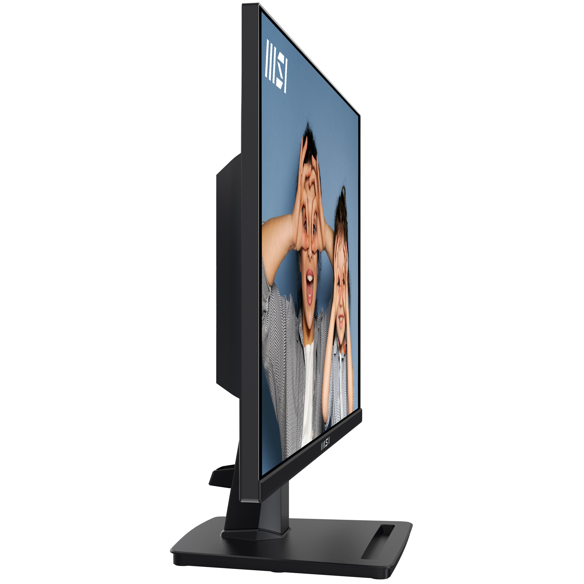 A monitor shows a person's face with their fingers forming eye shapes.