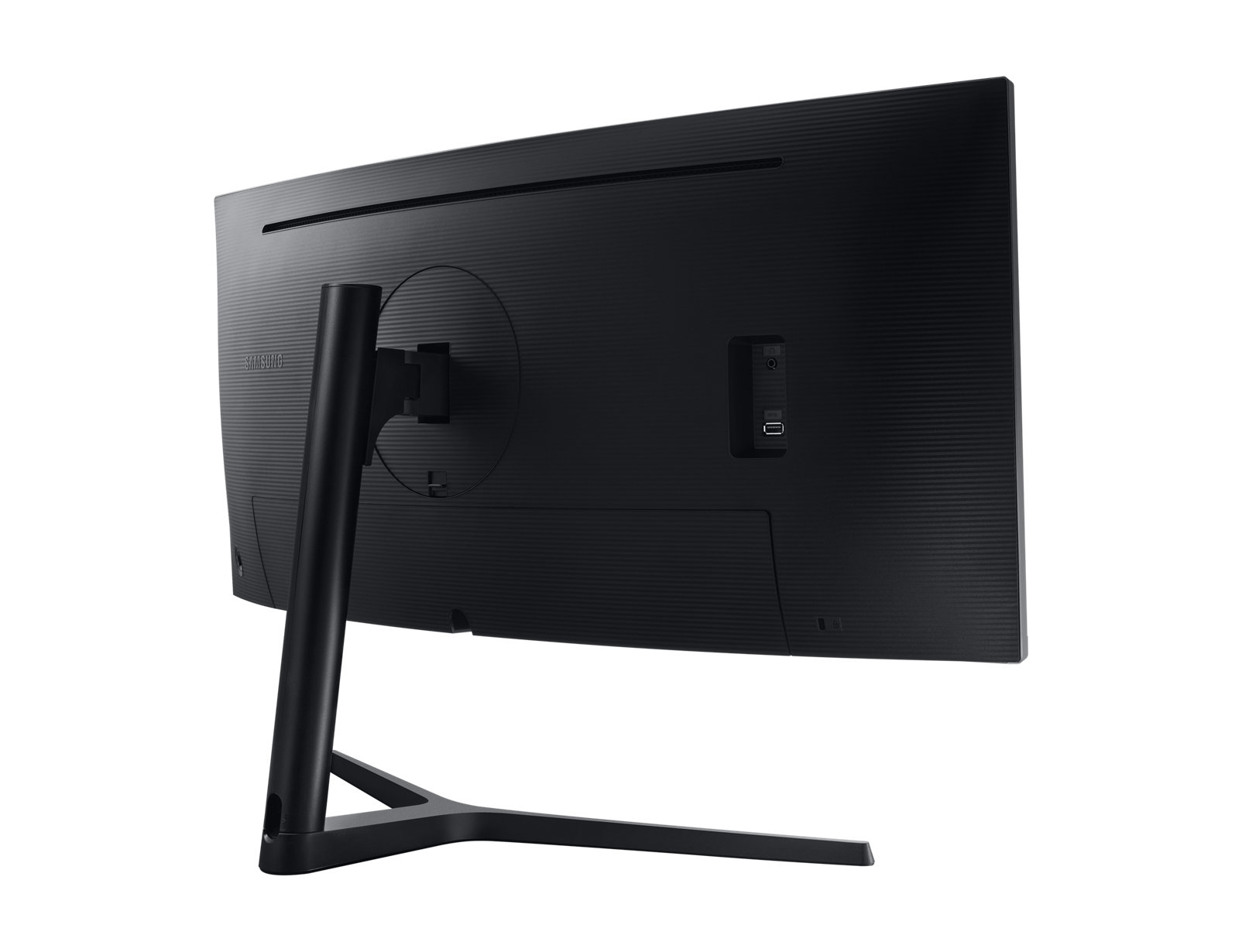 Vista trasera del monitor Samsung negro. Soporte y conexiones visibles. Fondo blanco.