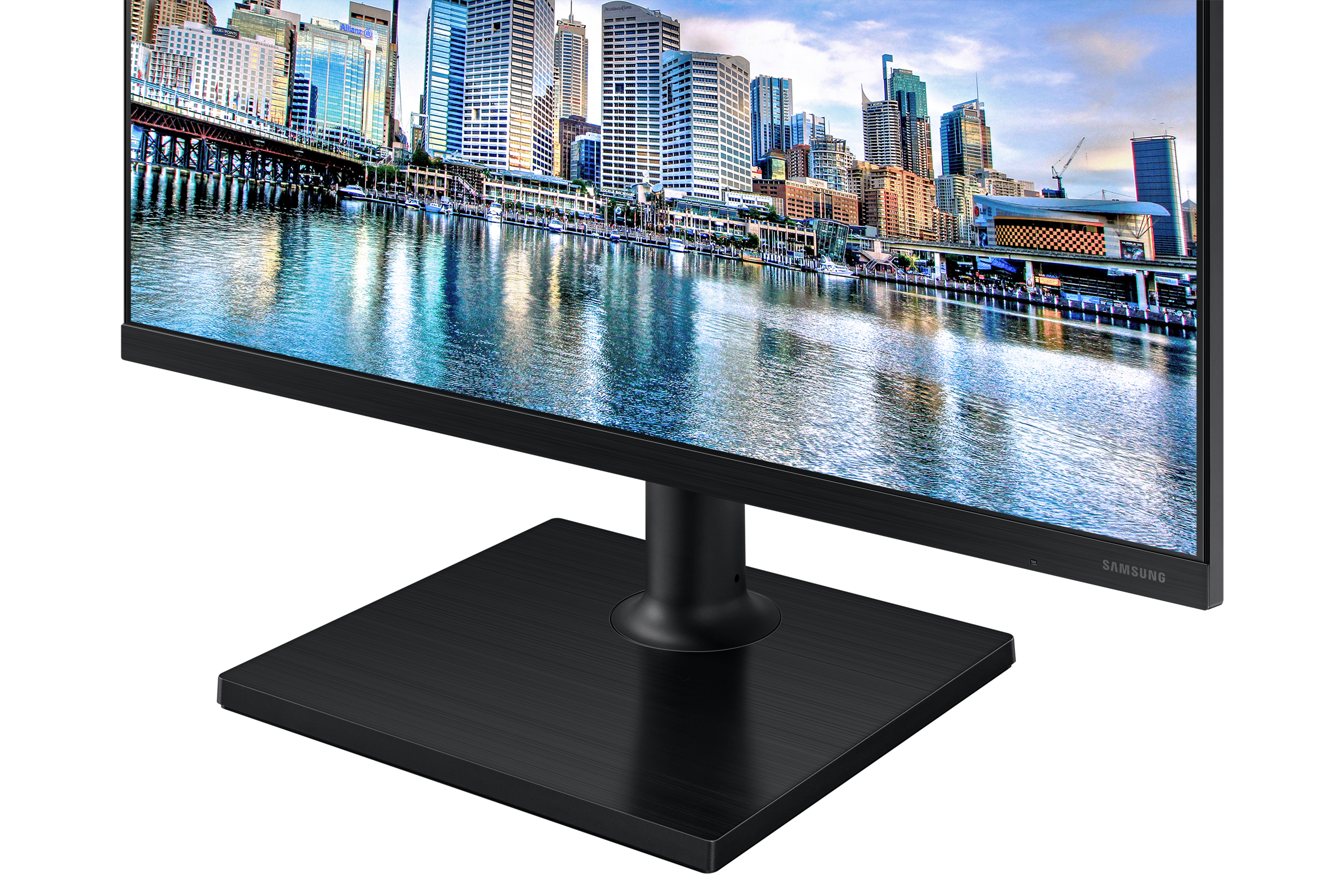 Monitor nero con skyline della città sullo schermo. La base è nera e quadrata.