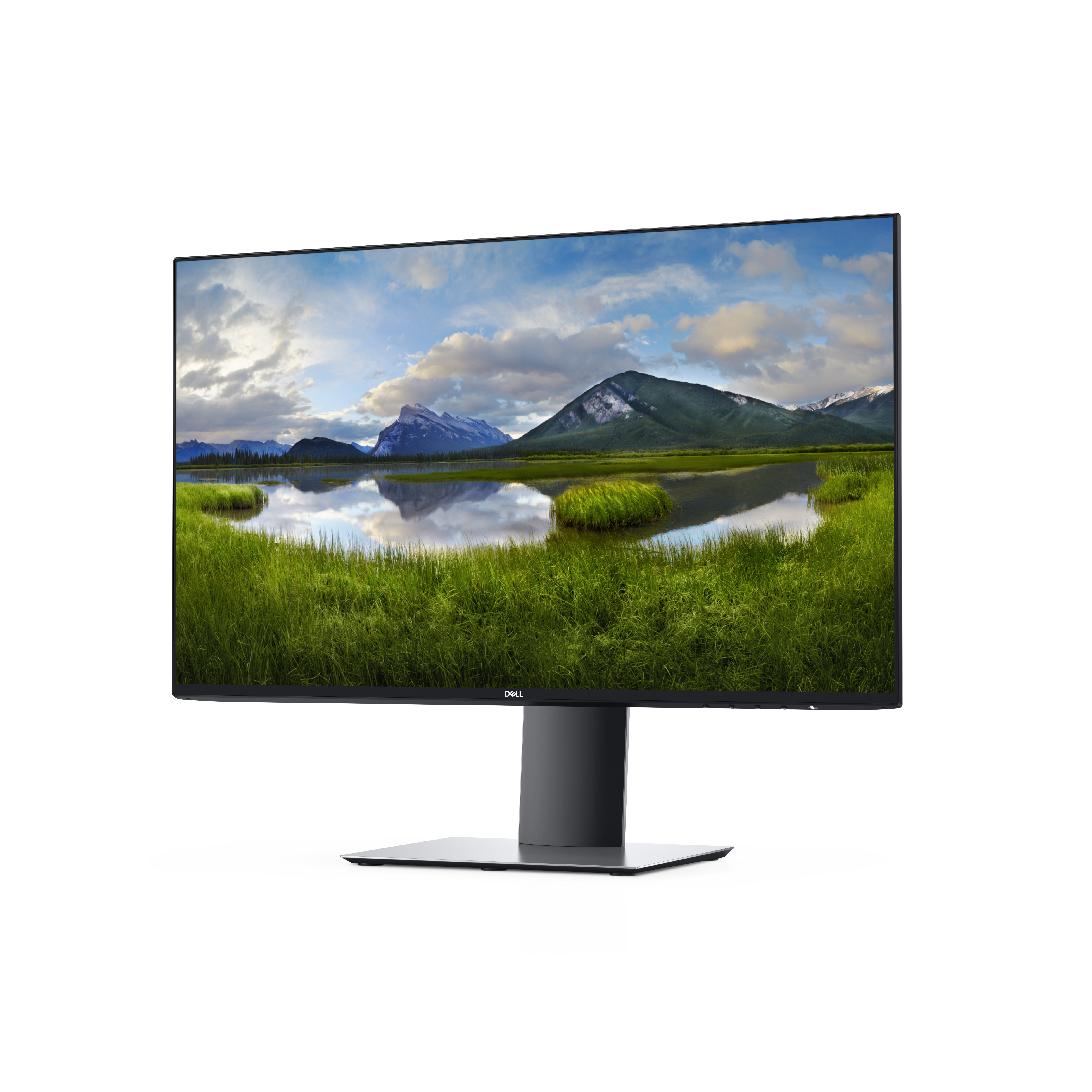 Ein Dell-Monitor zeigt eine Landschaftsszene mit Bergen und einem See. Er hat einen schwarzen Ständer und weißen Hintergrund.