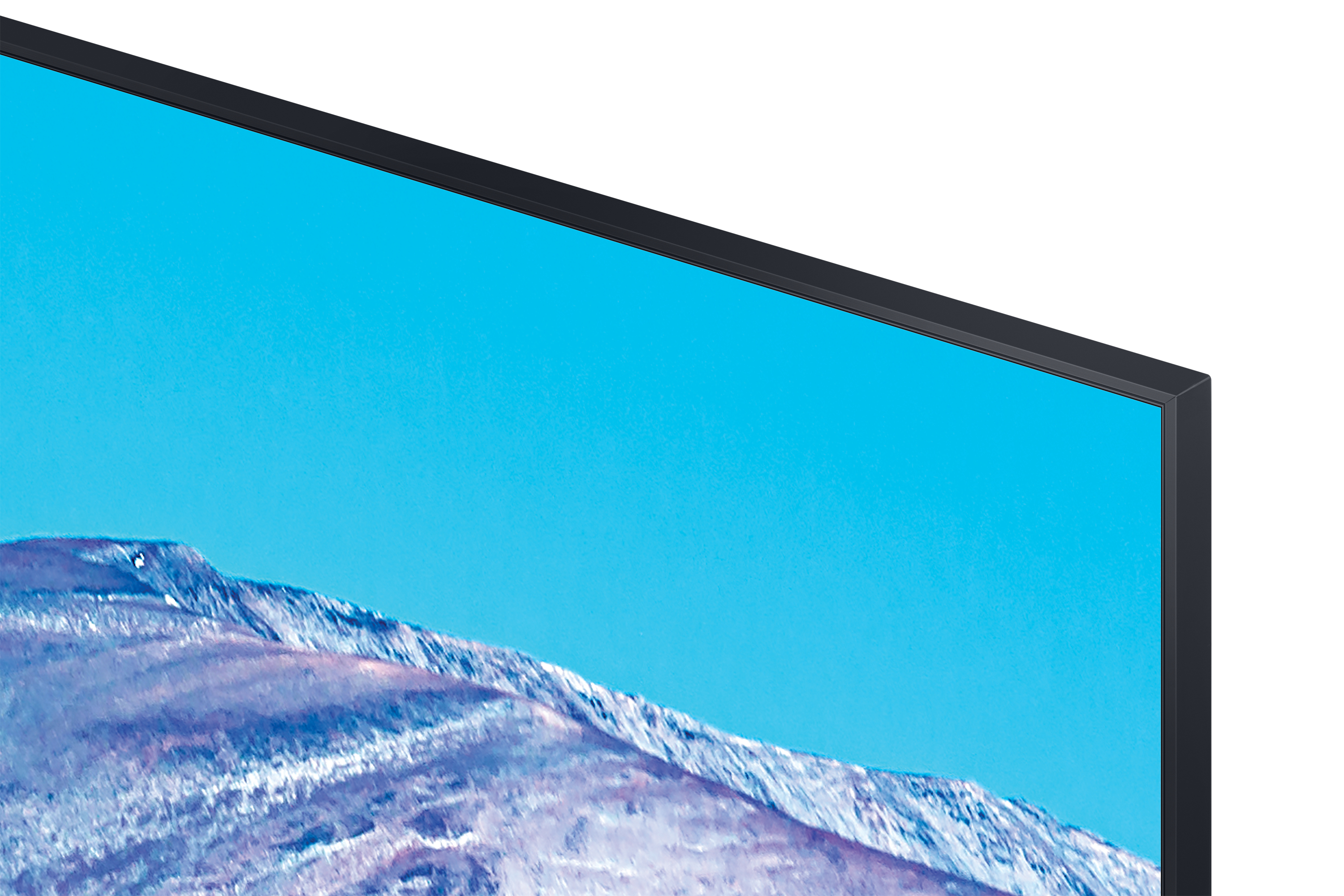 Zbliżenie na ekran monitora, pokazujące błękitne niebo i ośnieżone góry.