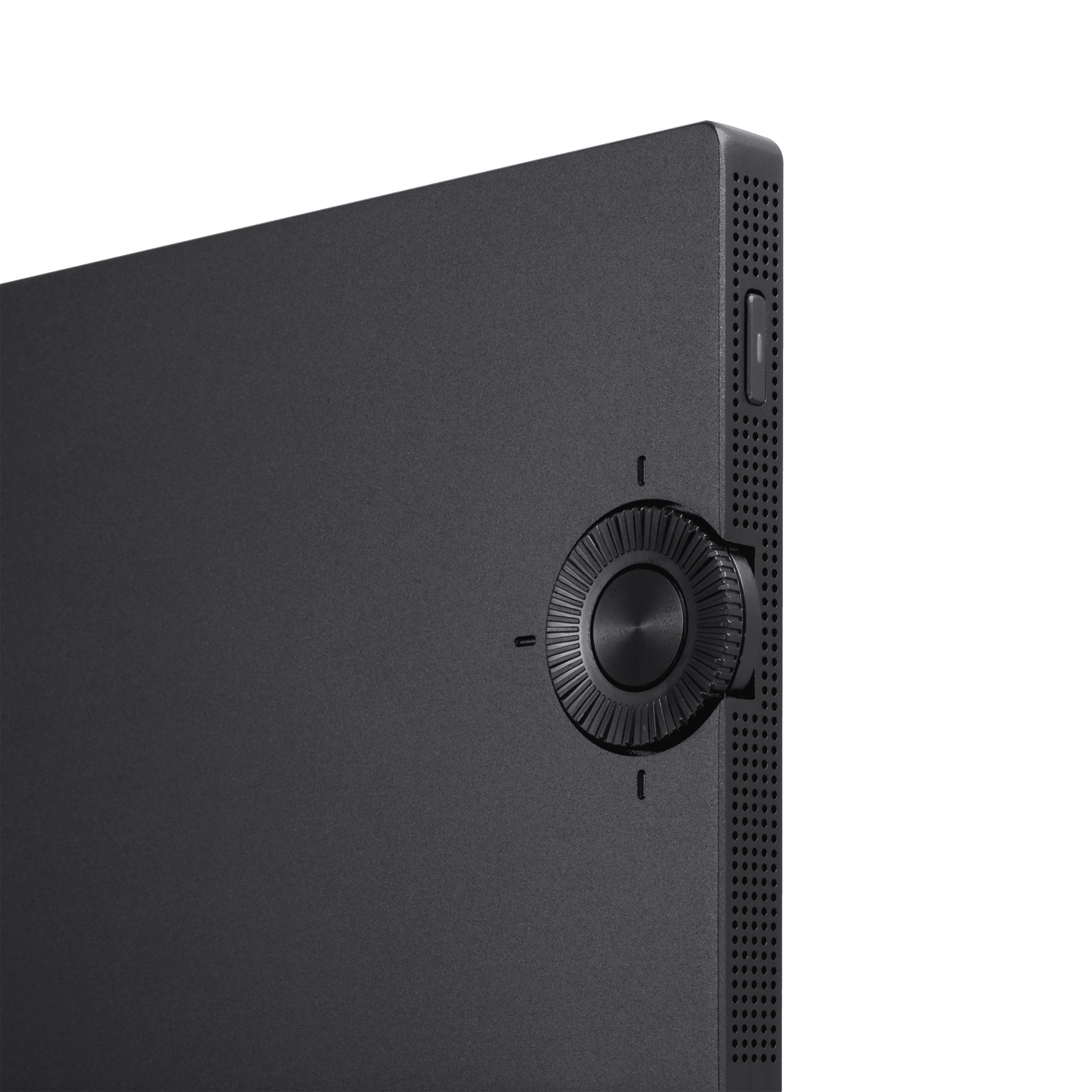 Czarny bok urządzenia z pokrętłem. Powierzchnia jest teksturowana i ma małe otwory.