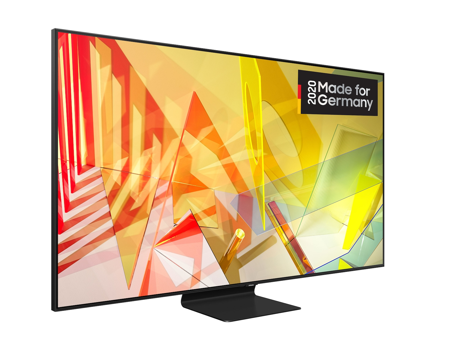 Czarna oprawiona telewizja wyświetla abstrakcyjne żółte i czerwone kształty. Ma czarną podstawę i