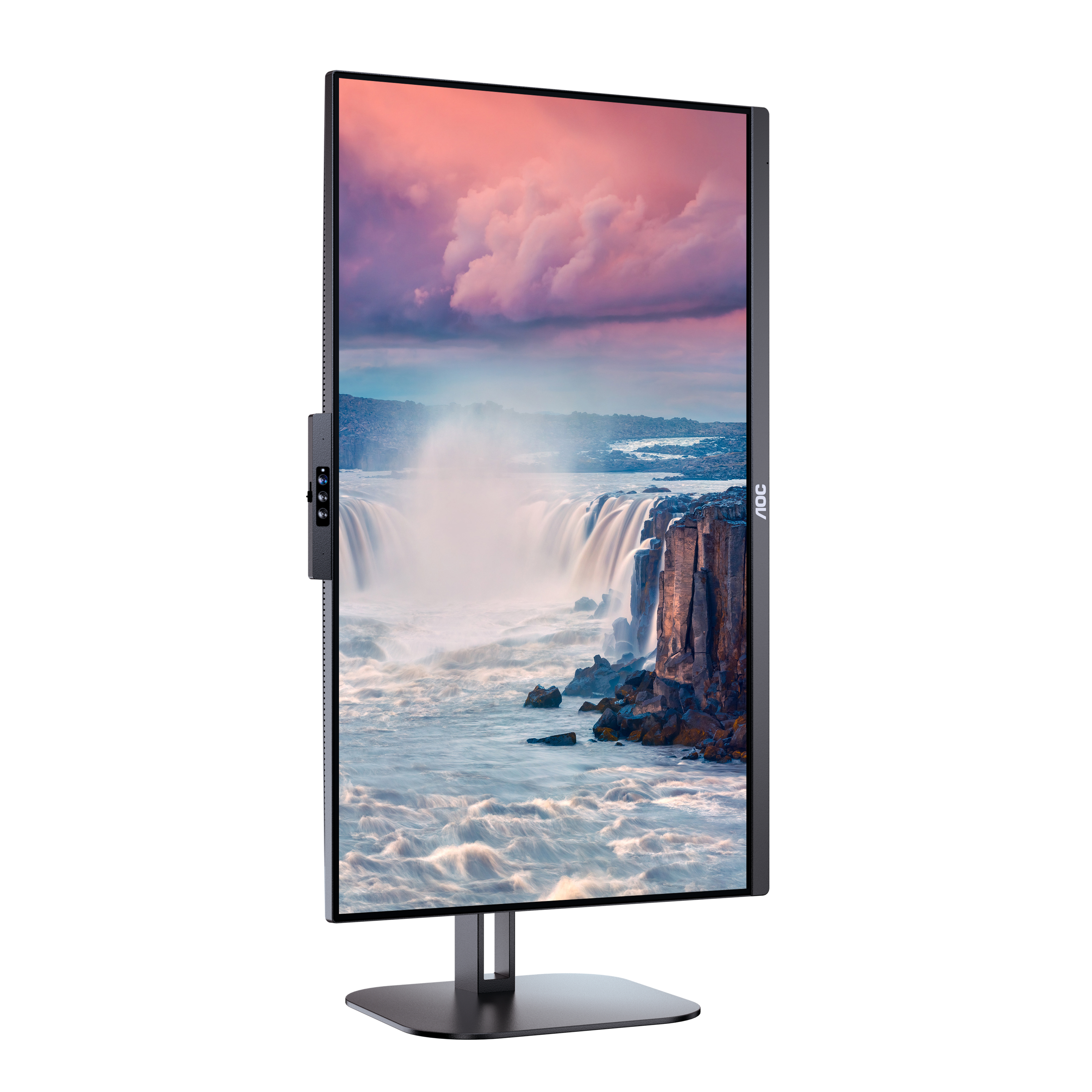 An AOC monitor in portrait mode displays a waterfall scene. The frame is black.