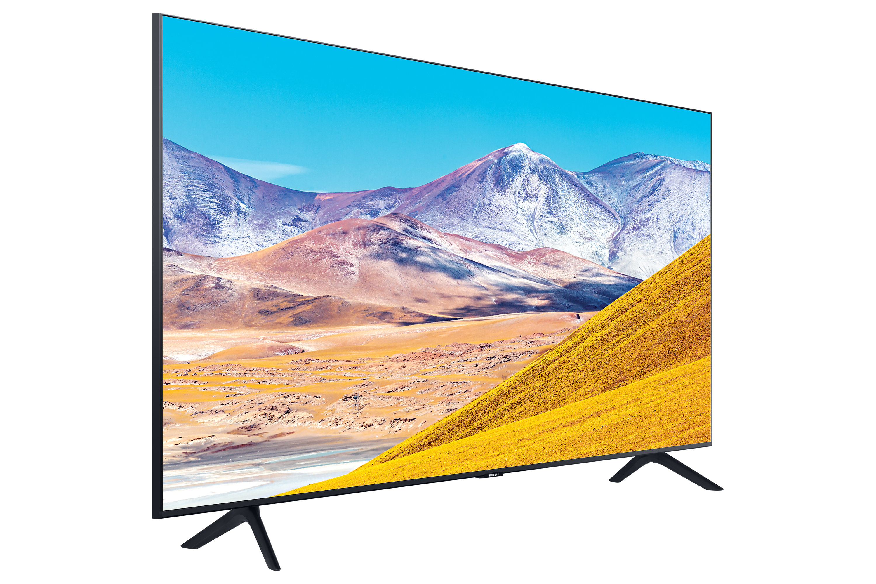 La TV mostra un paesaggio giallo con cielo blu. Cornice nera, gambe nere, sfondo bianco.