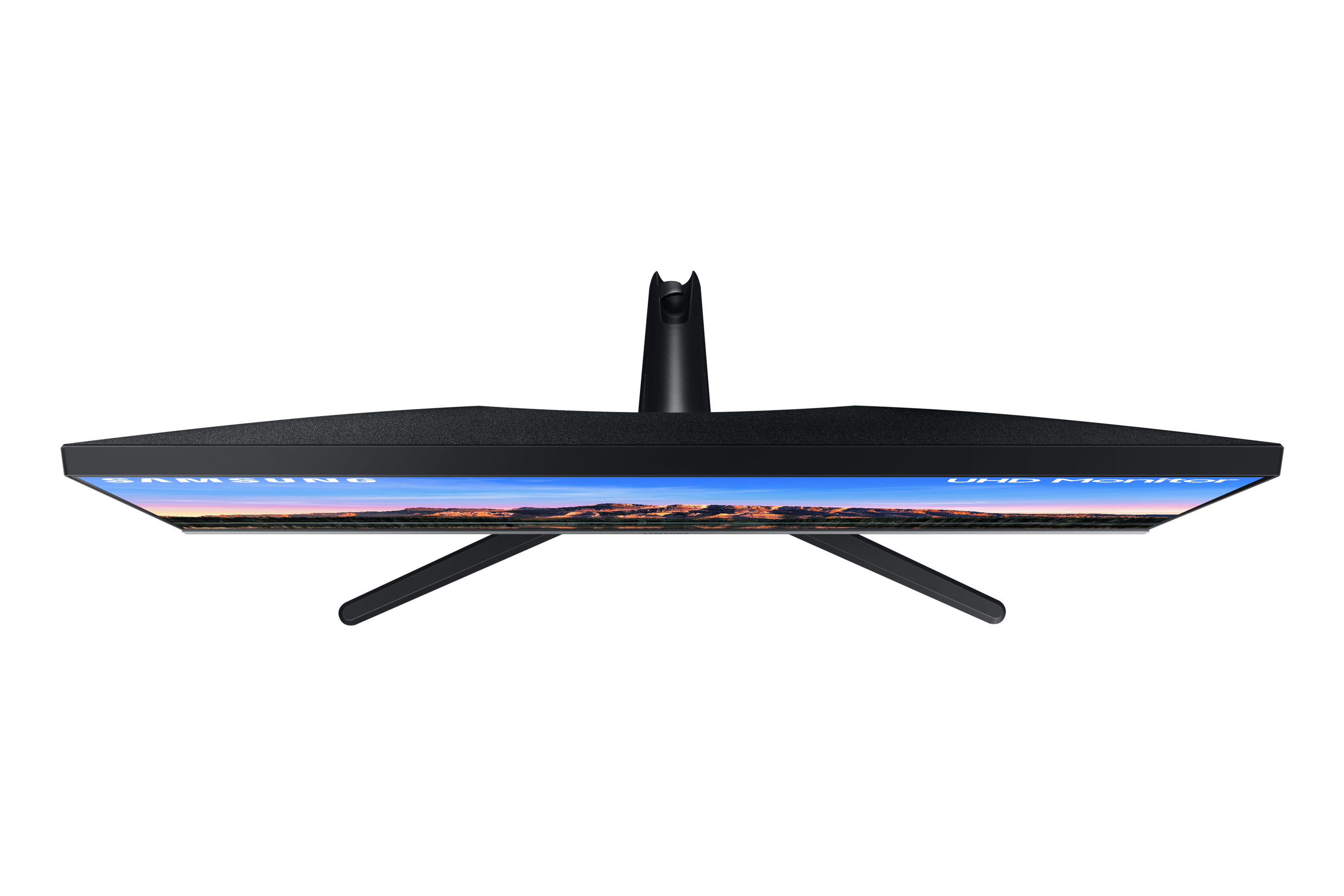 Vista superior de un monitor negro con soporte negro. La pantalla tiene fondo azul.