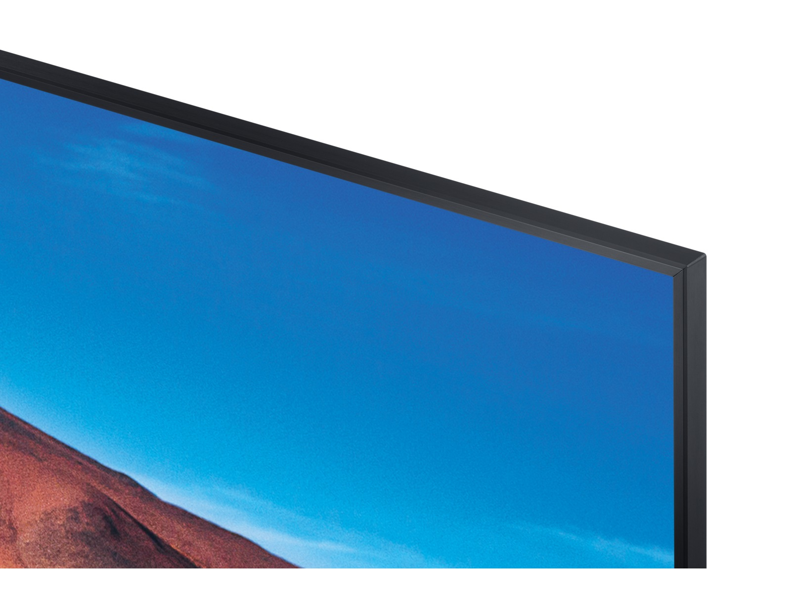 Monitor Dell, che mostra una scena paesaggistica. Erba verde, montagne e cielo visibili. Supporto nero.