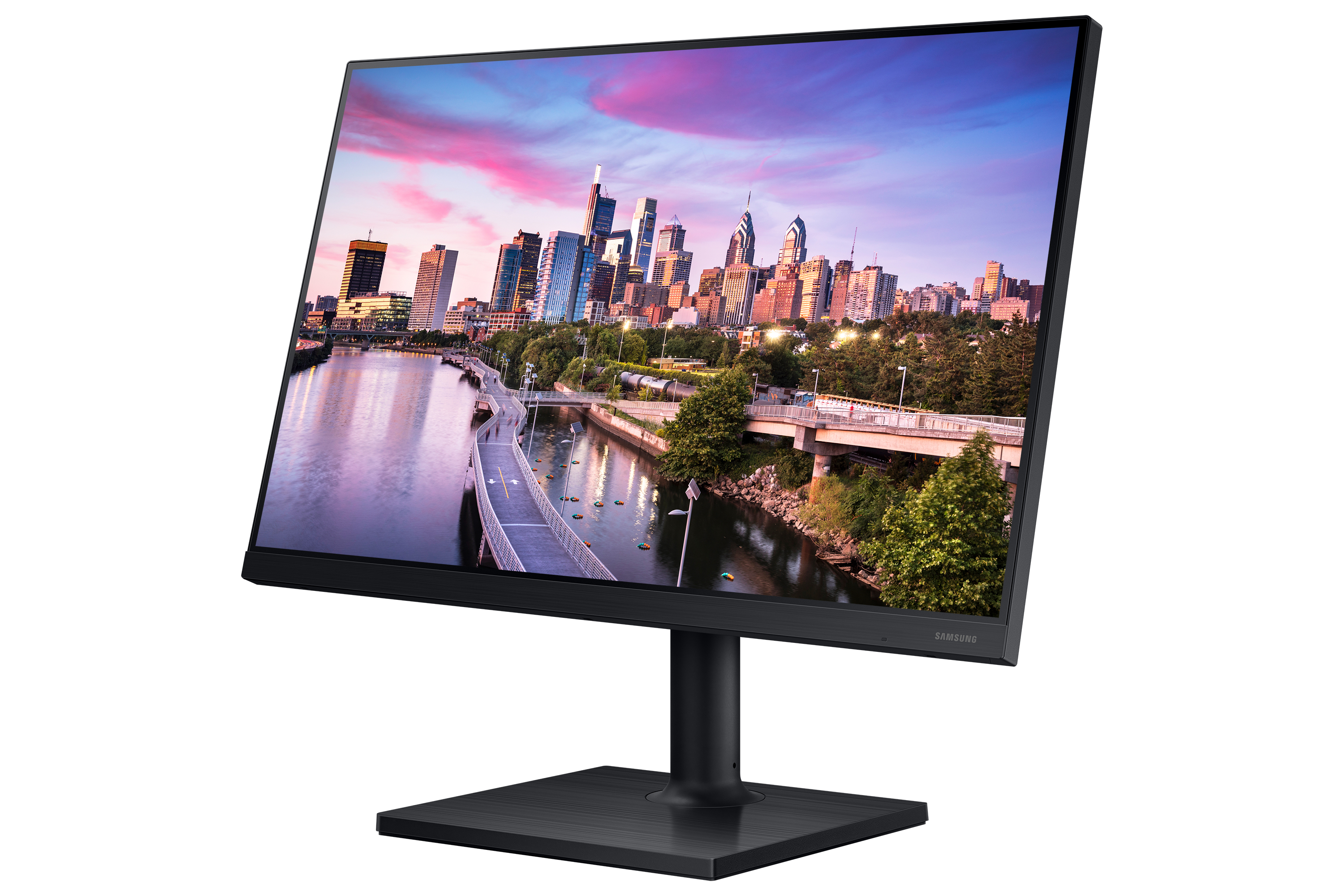 Monitor Samsung negro muestra una escena urbana. El monitor está sobre un soporte negro, fondo blanco.