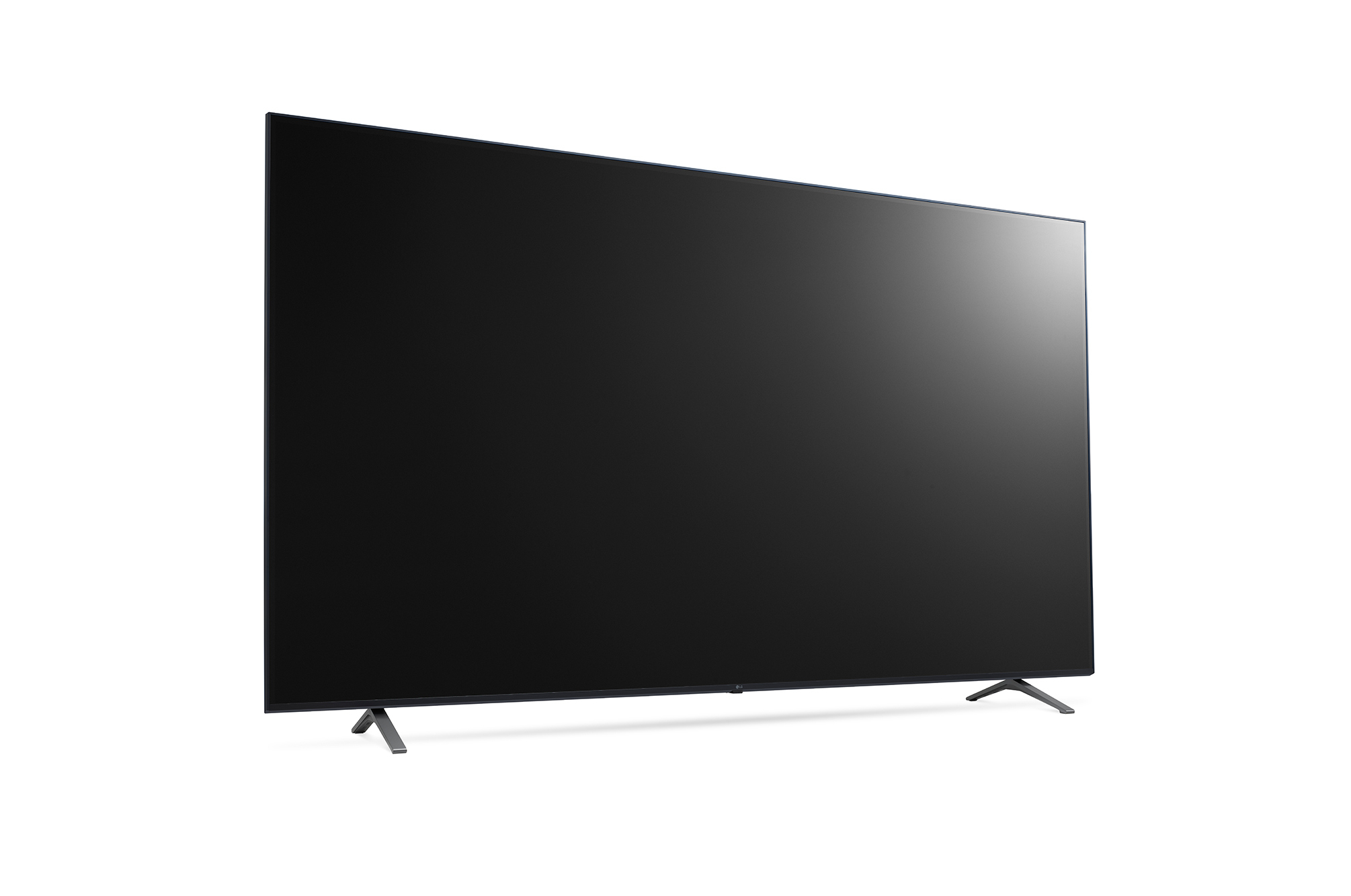 Een grote flatscreen tv vanuit een zijkant, met een zwart scherm en twee zilveren voeten.