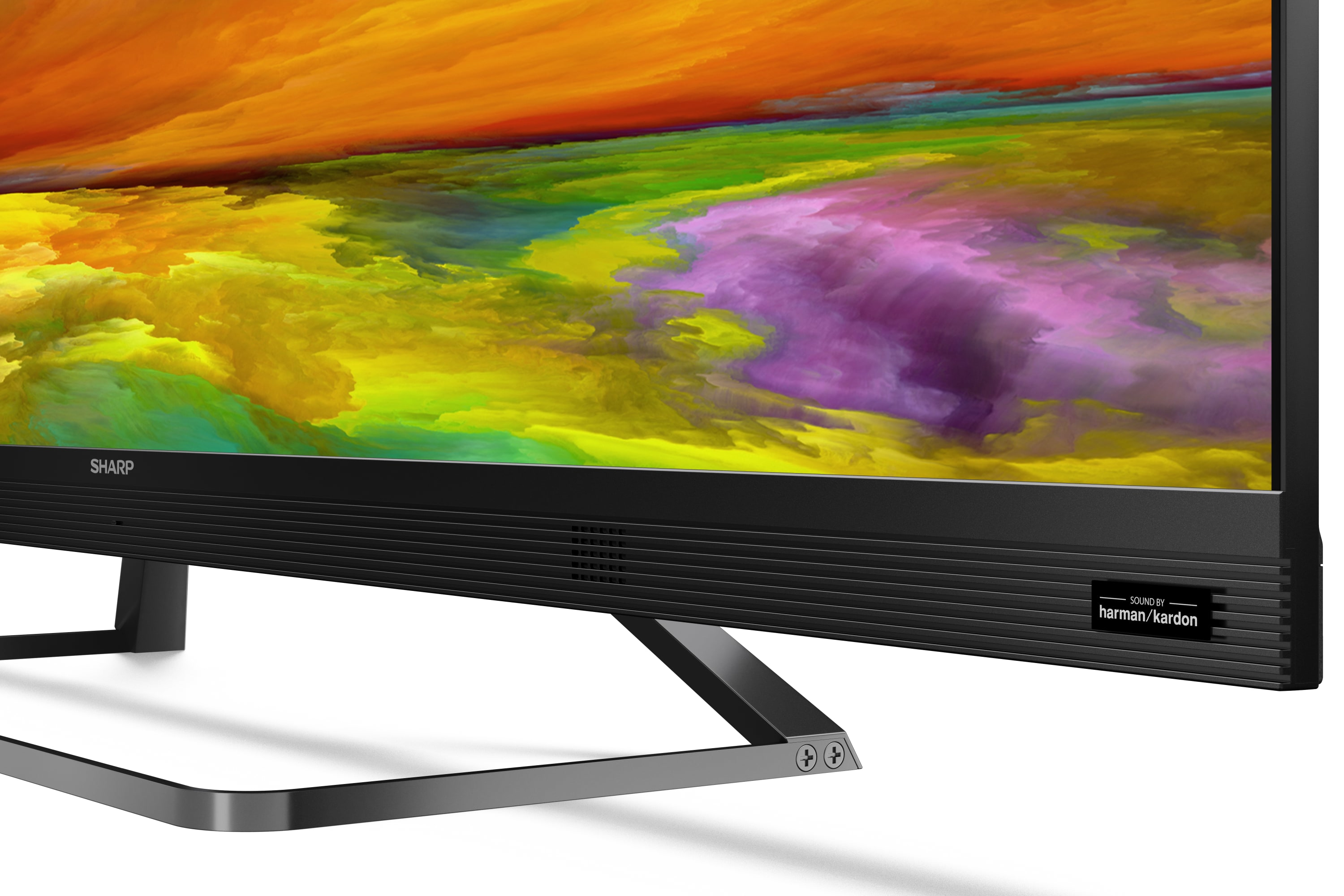 Nahaufnahme eines Sharp-Monitors mit farbenfroher Anzeige. Die Basis hat ein Label.