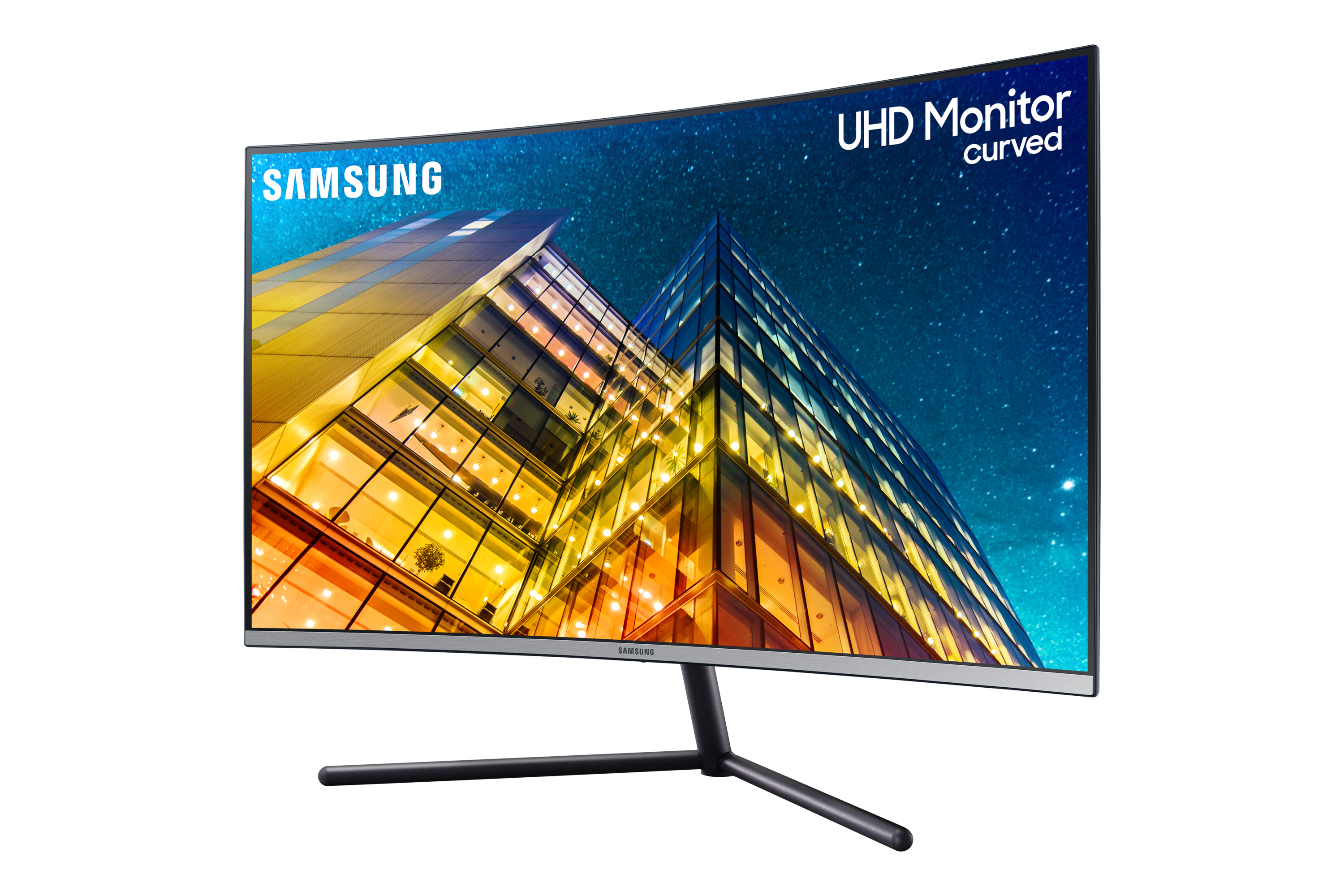 Un monitor Samsung UHD curvo con sfondo di città e notte stellata.