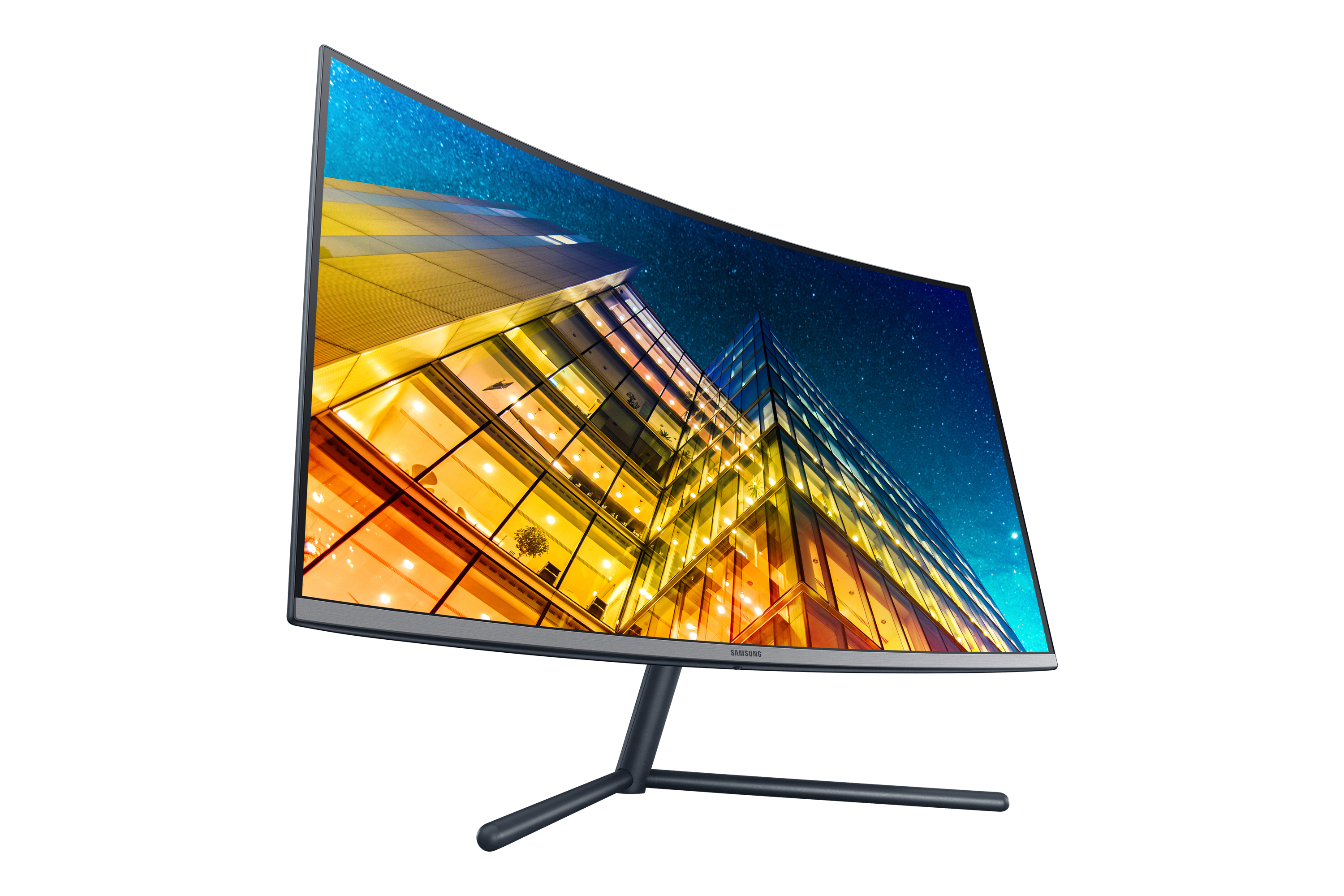 Monitor Samsung curvo con esterno di un edificio sullo schermo. Supporto nero. Bianco.