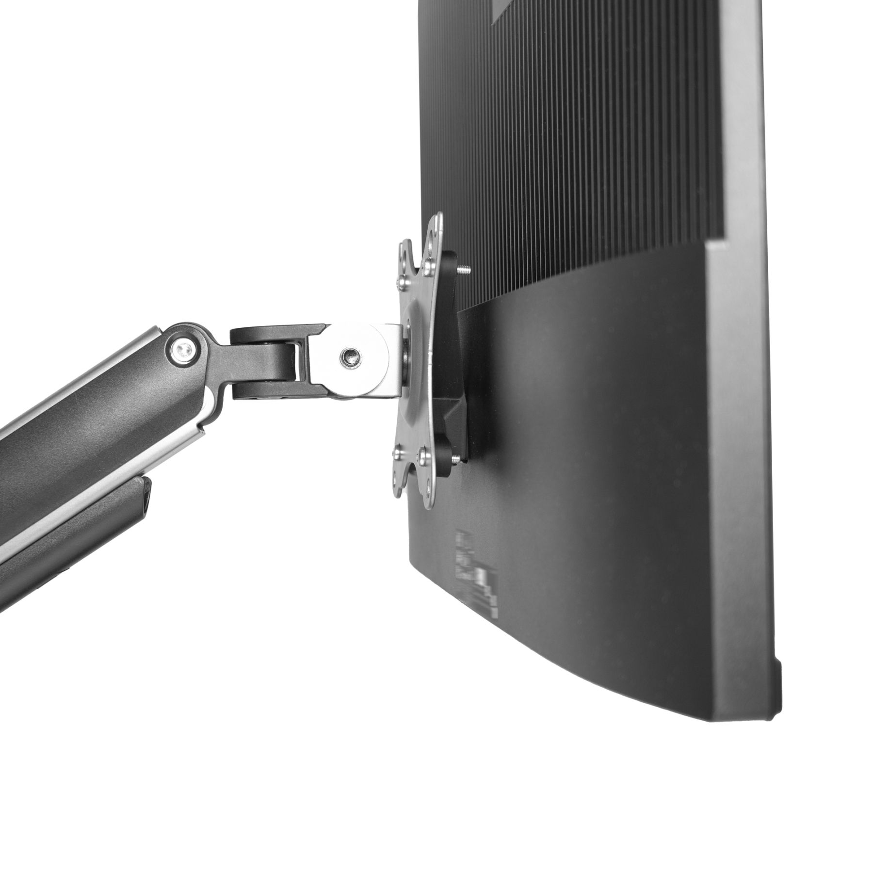 Monitor an einem mechanischen Arm befestigt. Der Arm ist mit einem Schreibtisch verbunden.