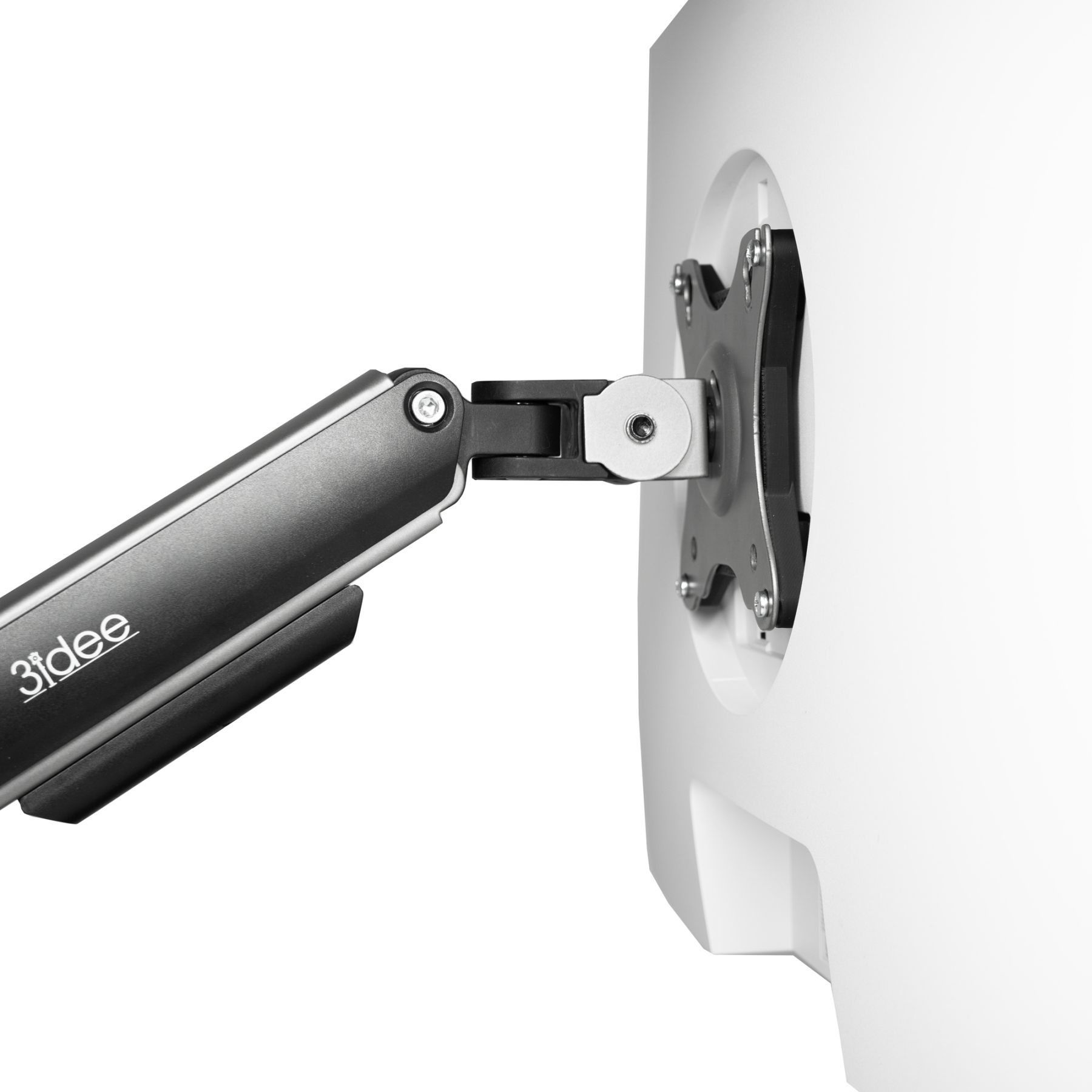 Ein Monitorarm an einer weißen Oberfläche befestigt. Der Arm ist dunkelgrau, die Basis auf der Oberfläche.