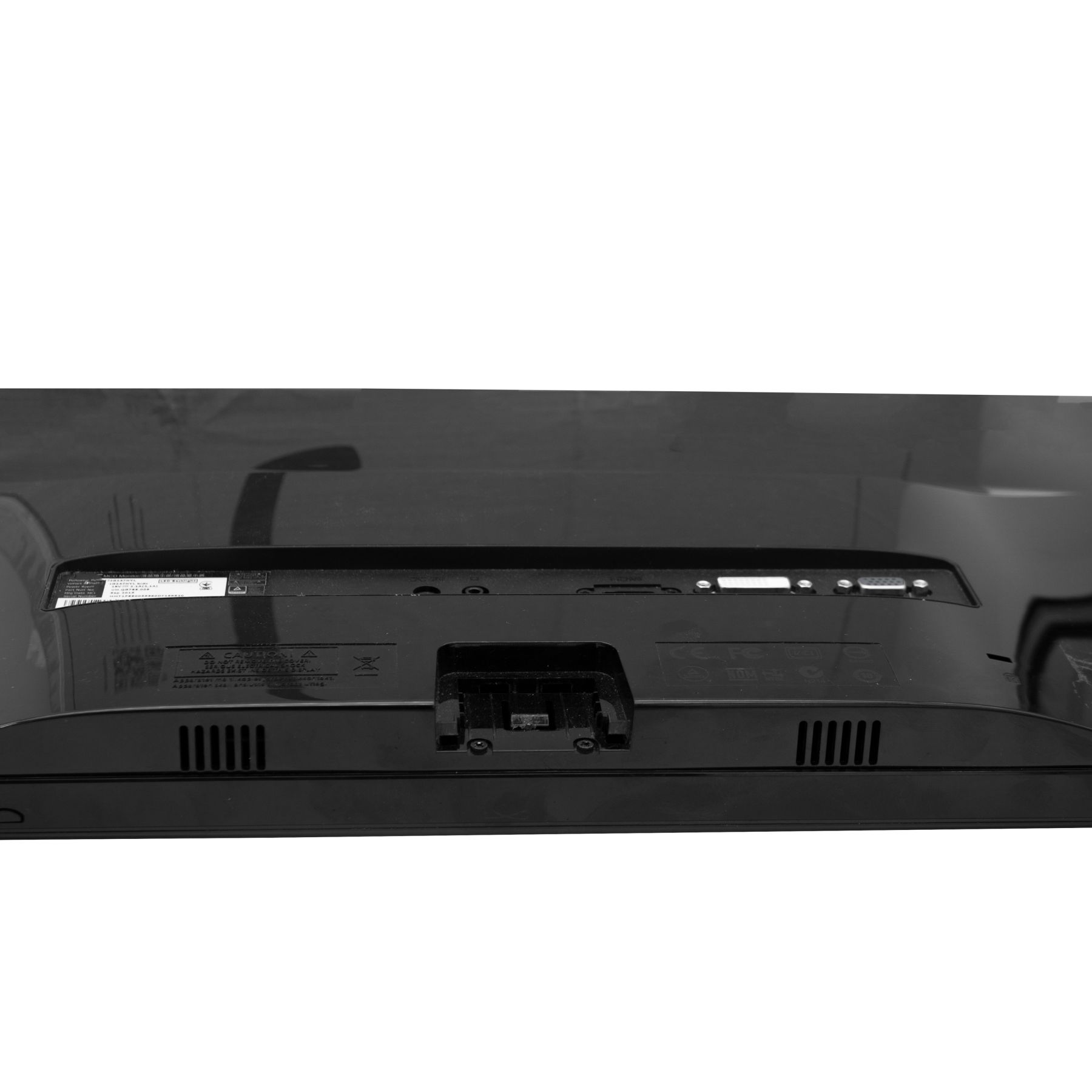 Rückseite eines schwarzen Computermonitors mit einigen Lüftungslöchern.