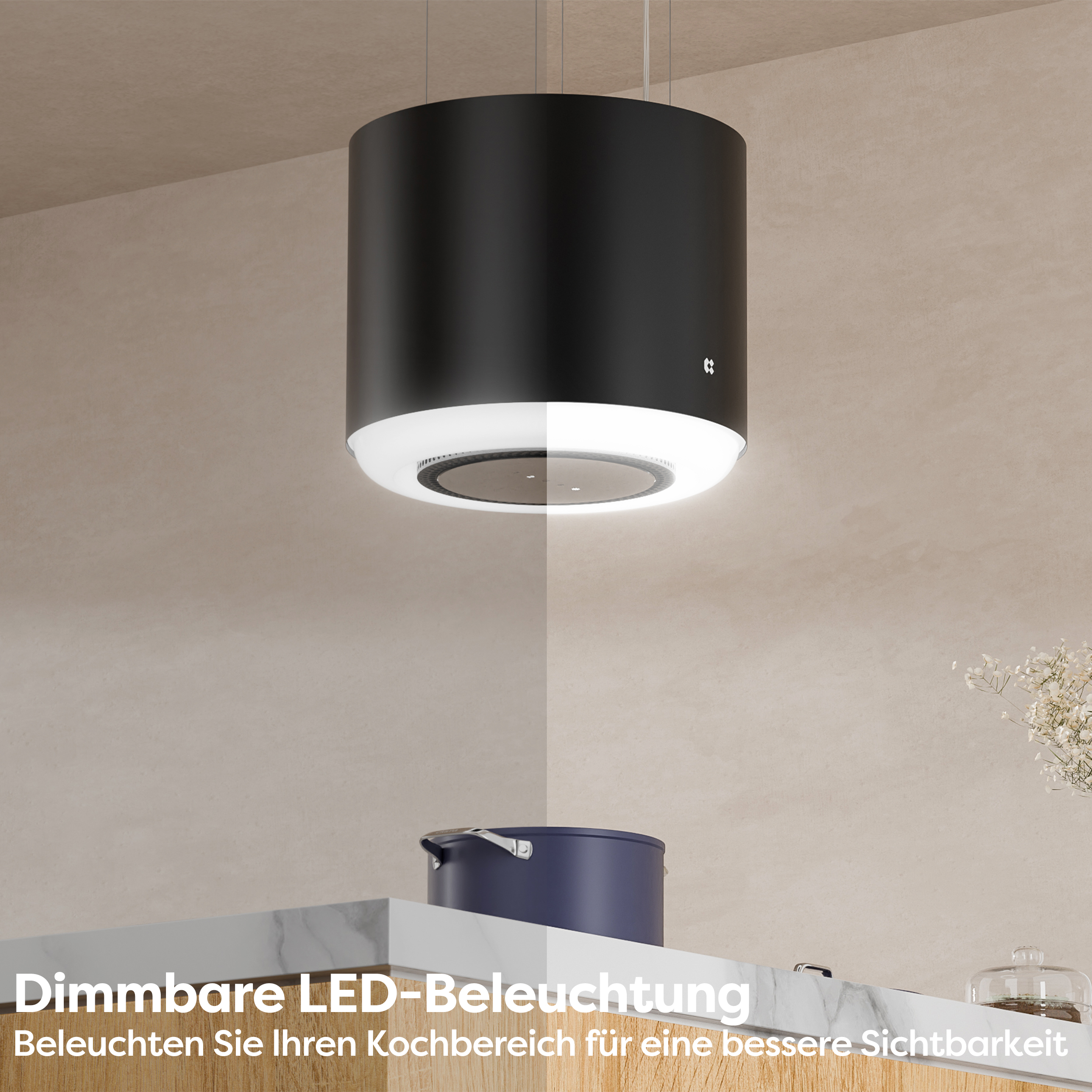 Eine schwarze zylindrische Küchenhaube mit Licht und einem Topf auf der Theke.