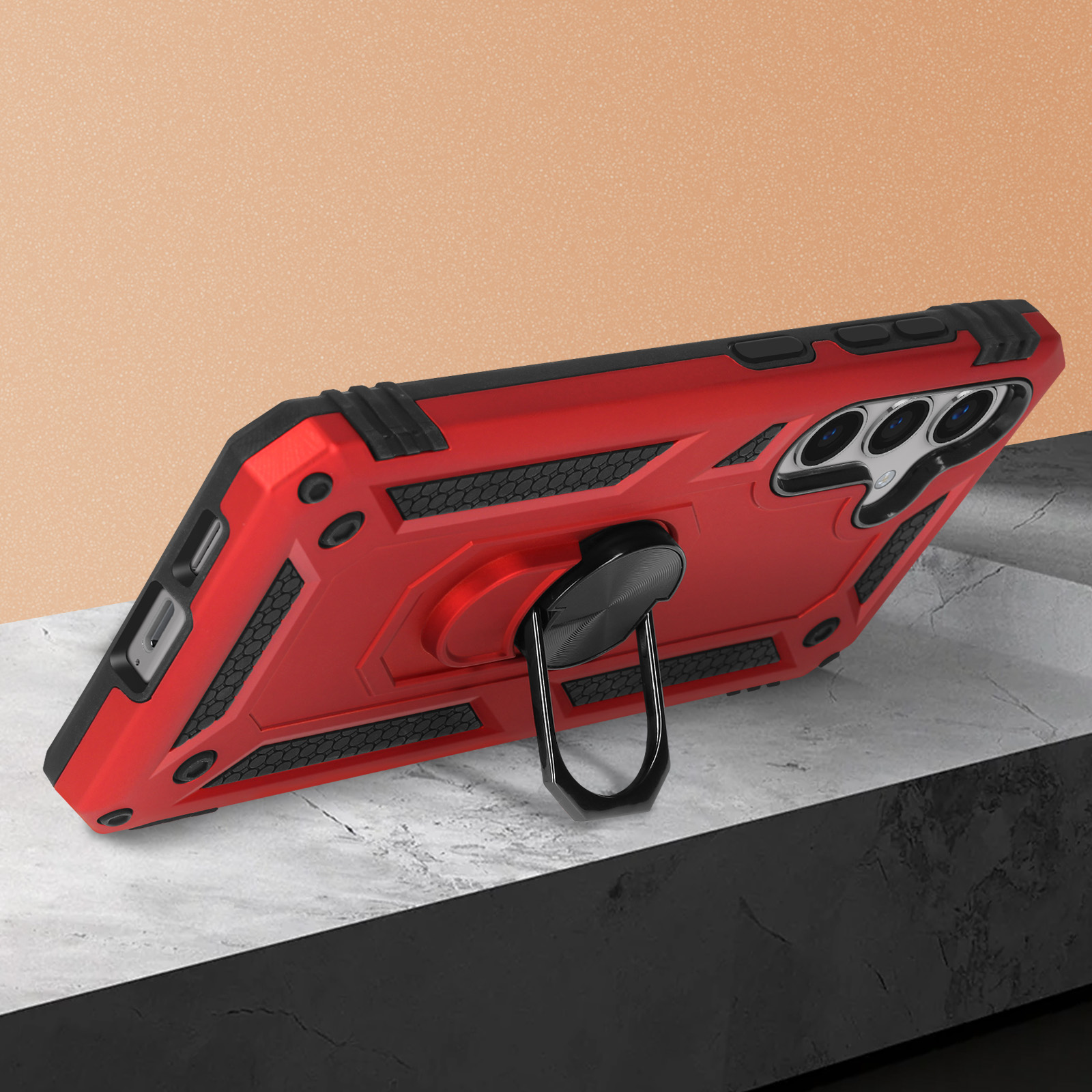 Coque de téléphone rouge avec un support d'anneau noir sur une surface texturée. La coque a des accents noirs.