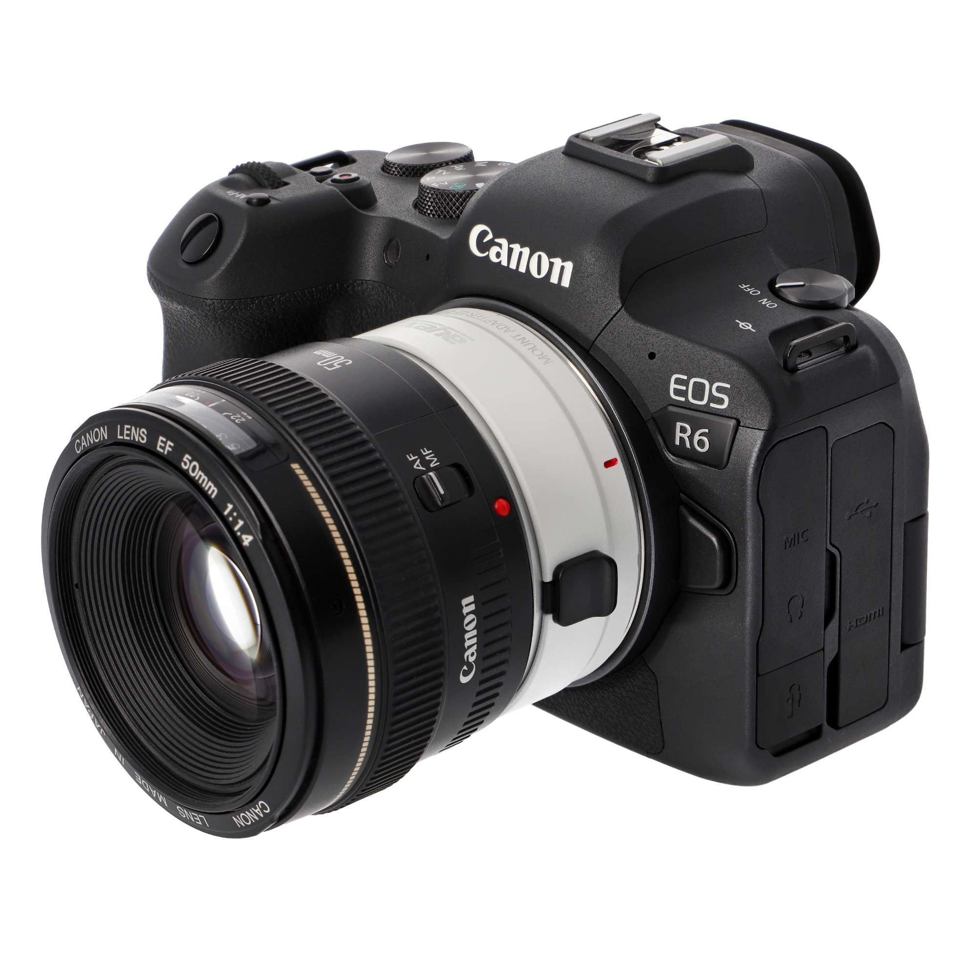 Schwarze Canon EOS R6 Kamera mit angesetztem Objektiv. Das Objektiv ist weiß und hat einen roten Punkt.