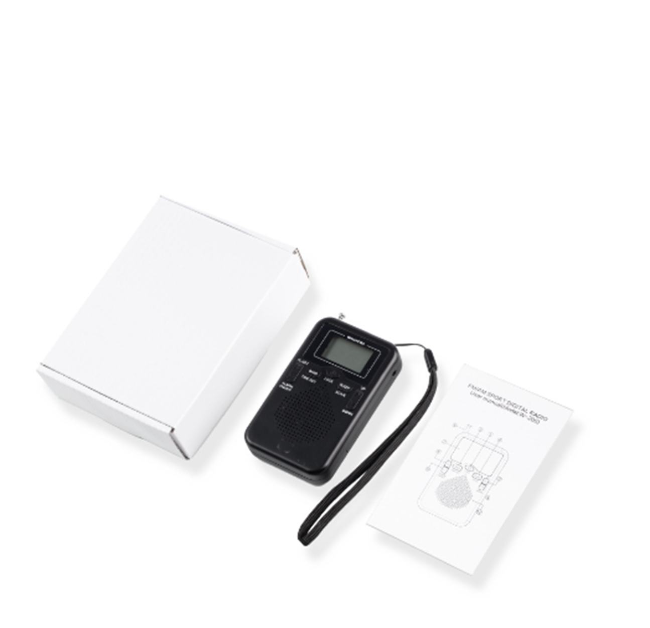 Schwarzes Radio, weiße Box und Handbuch auf weißer Oberfläche. Schwarzes Radio hat ein kleines Display.