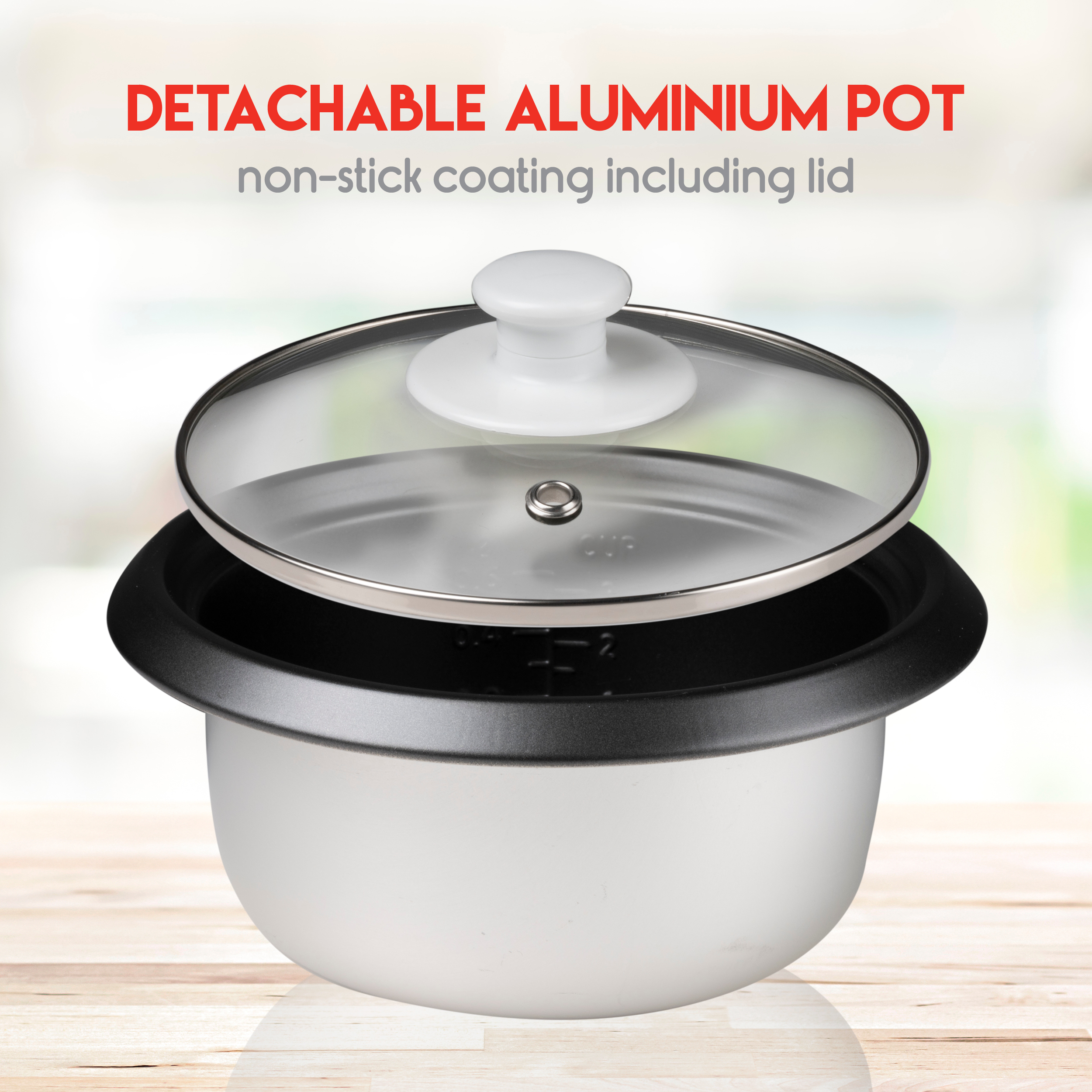 White and black rice cooker with a transparent lid, sitting on wood.