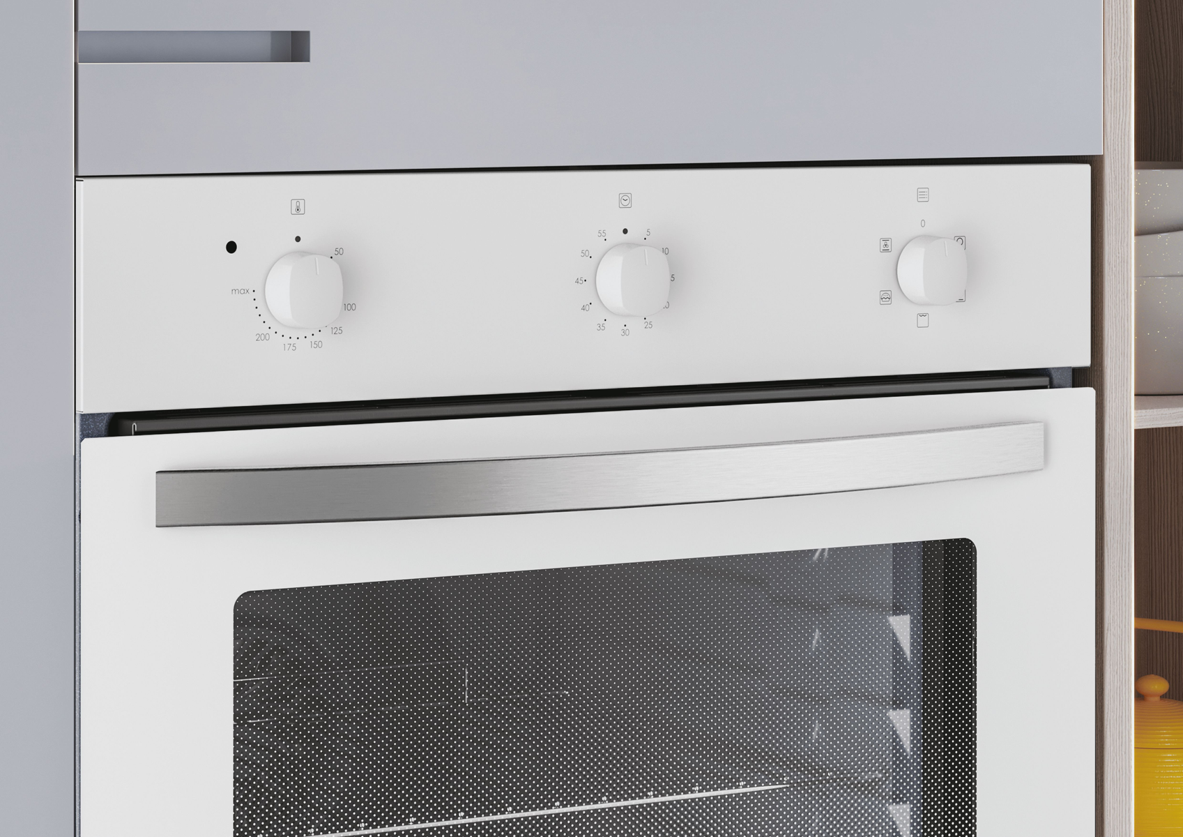 Un forno bianco con manopole. Il forno è incassato in un mobile da cucina.