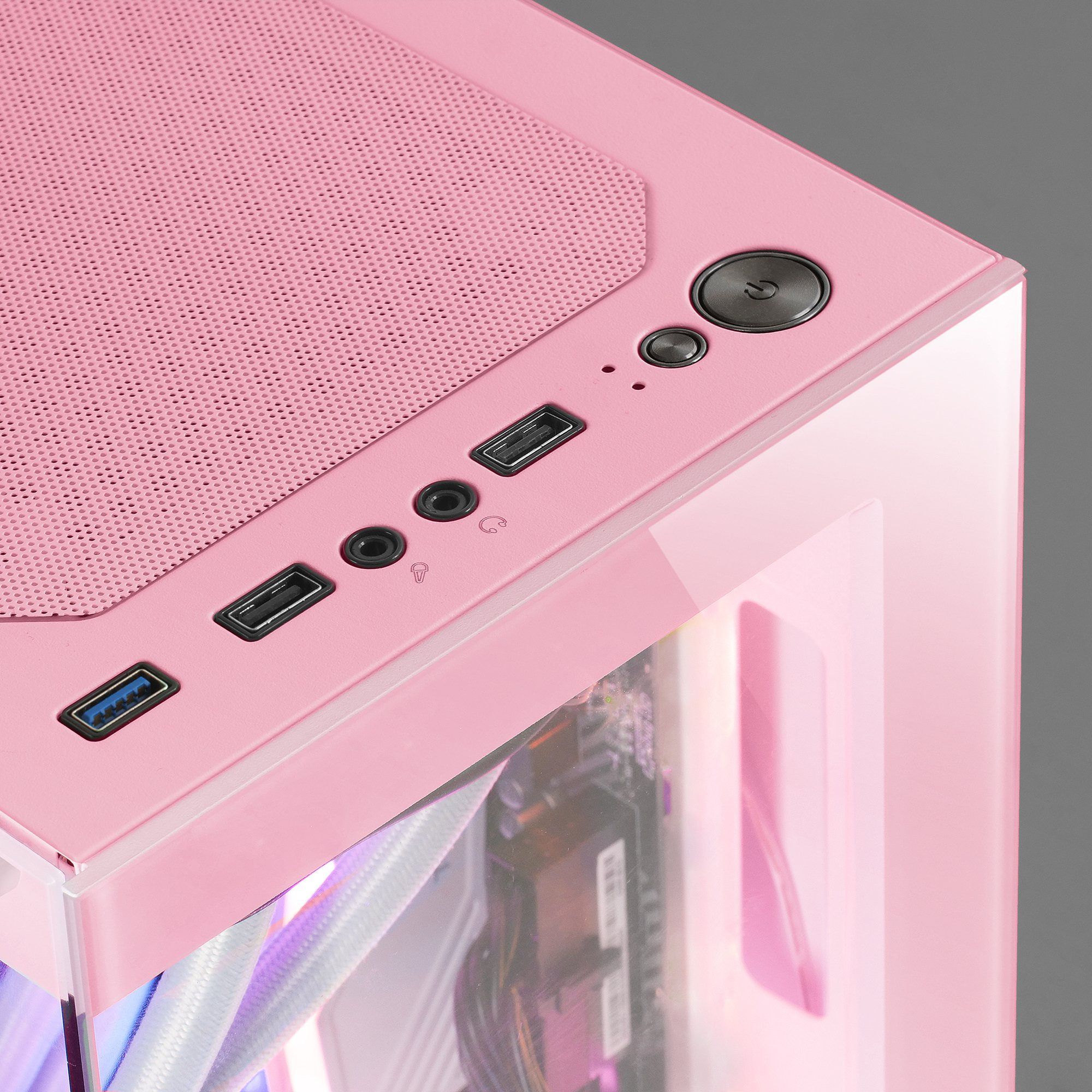 Carcasa de computadora rosa con puertos y botón de encendido, vista superior.