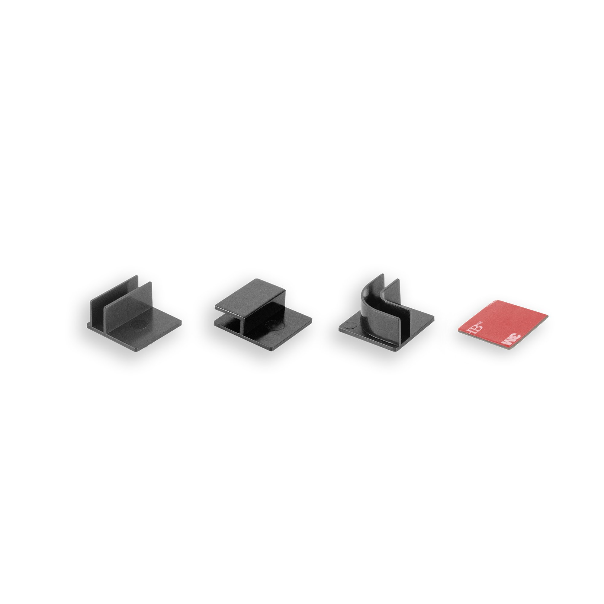 Cuatro conectores de plástico negro para muebles y una almohadilla adhesiva sobre superficie blanca.