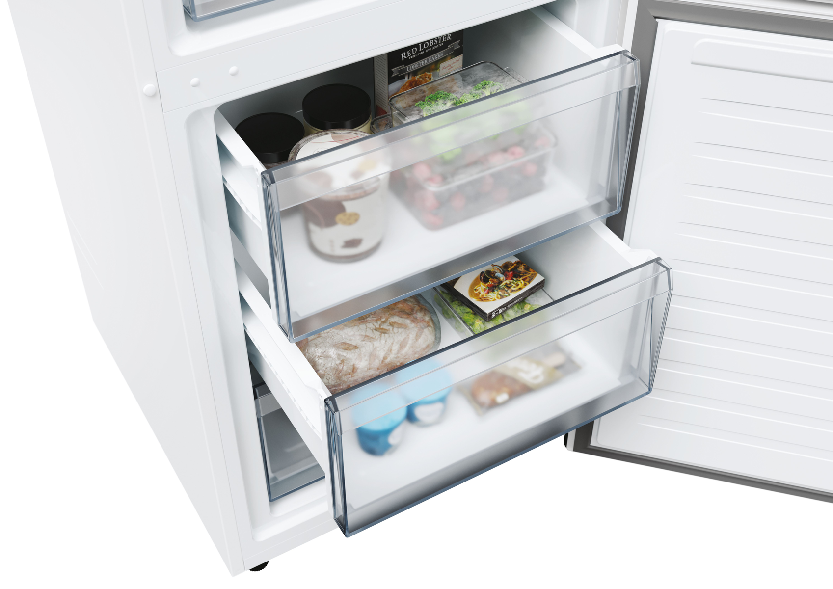 Cajones de refrigerador abiertos con alimentos. Hay recipientes y un pan.