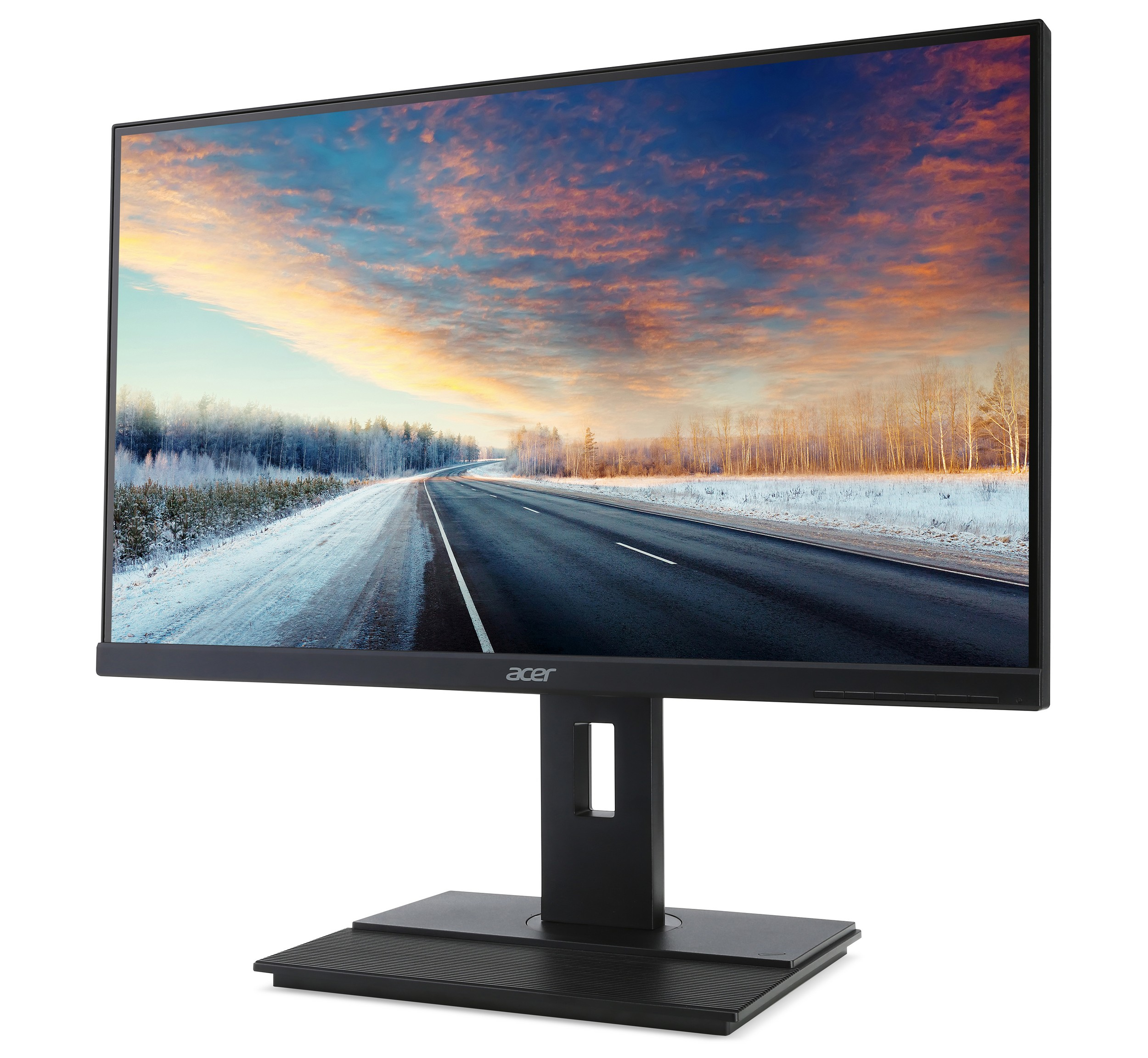 Monitor Acer mostrando una carretera a través de un paisaje invernal con atardecer.