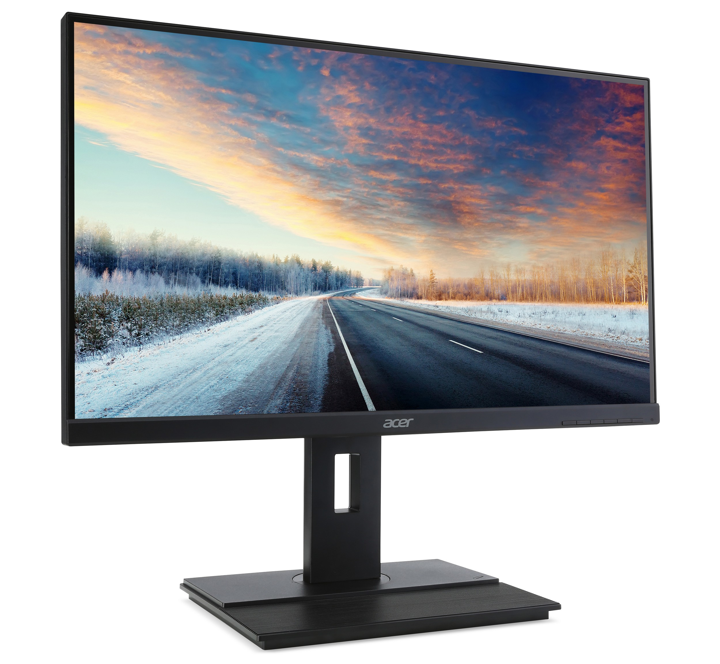 Monitor de computadora negro con imagen de paisaje. La pantalla muestra una carretera a través de un bosque nevado.
