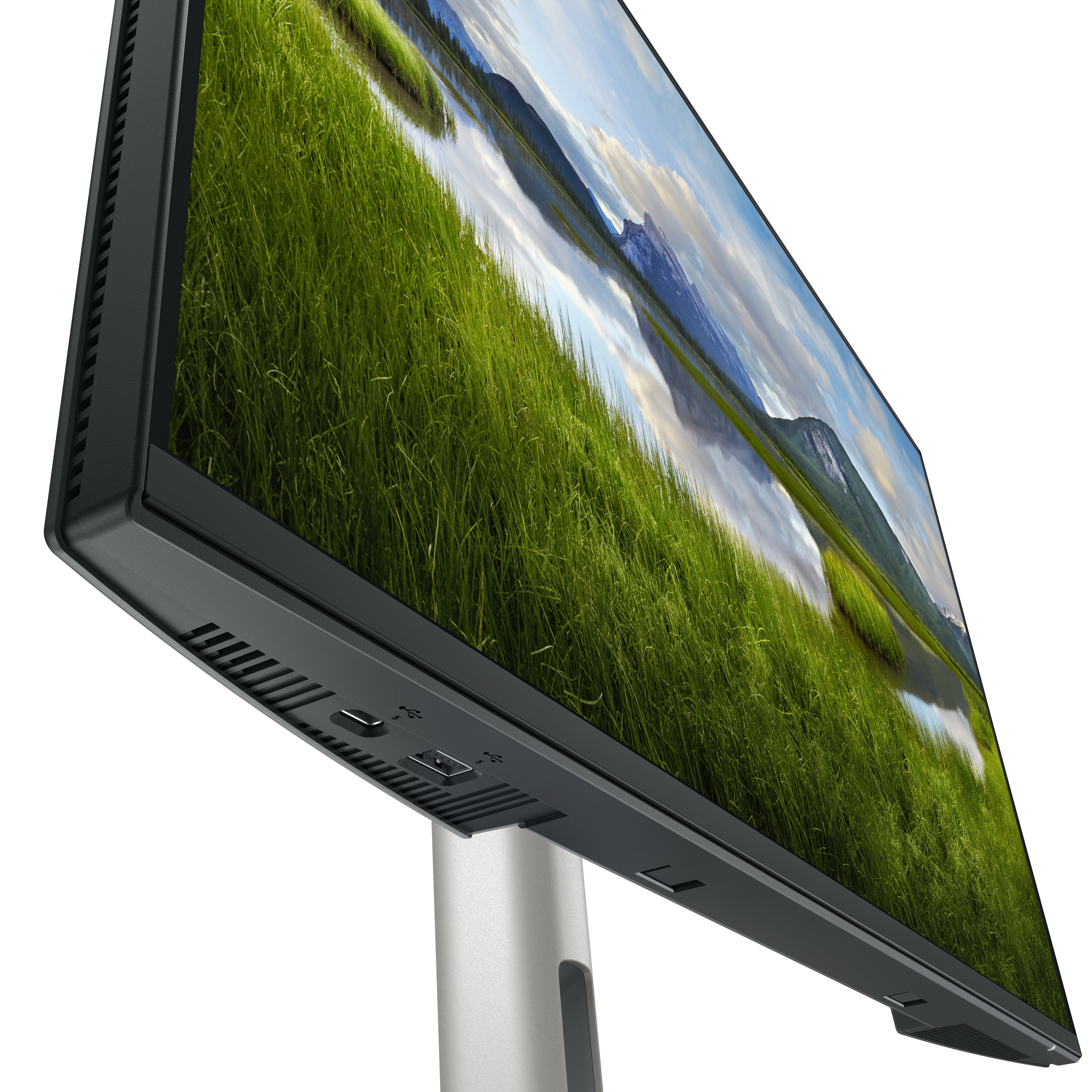 Un monitor de ordenador con una escena de paisaje y un marco negro.