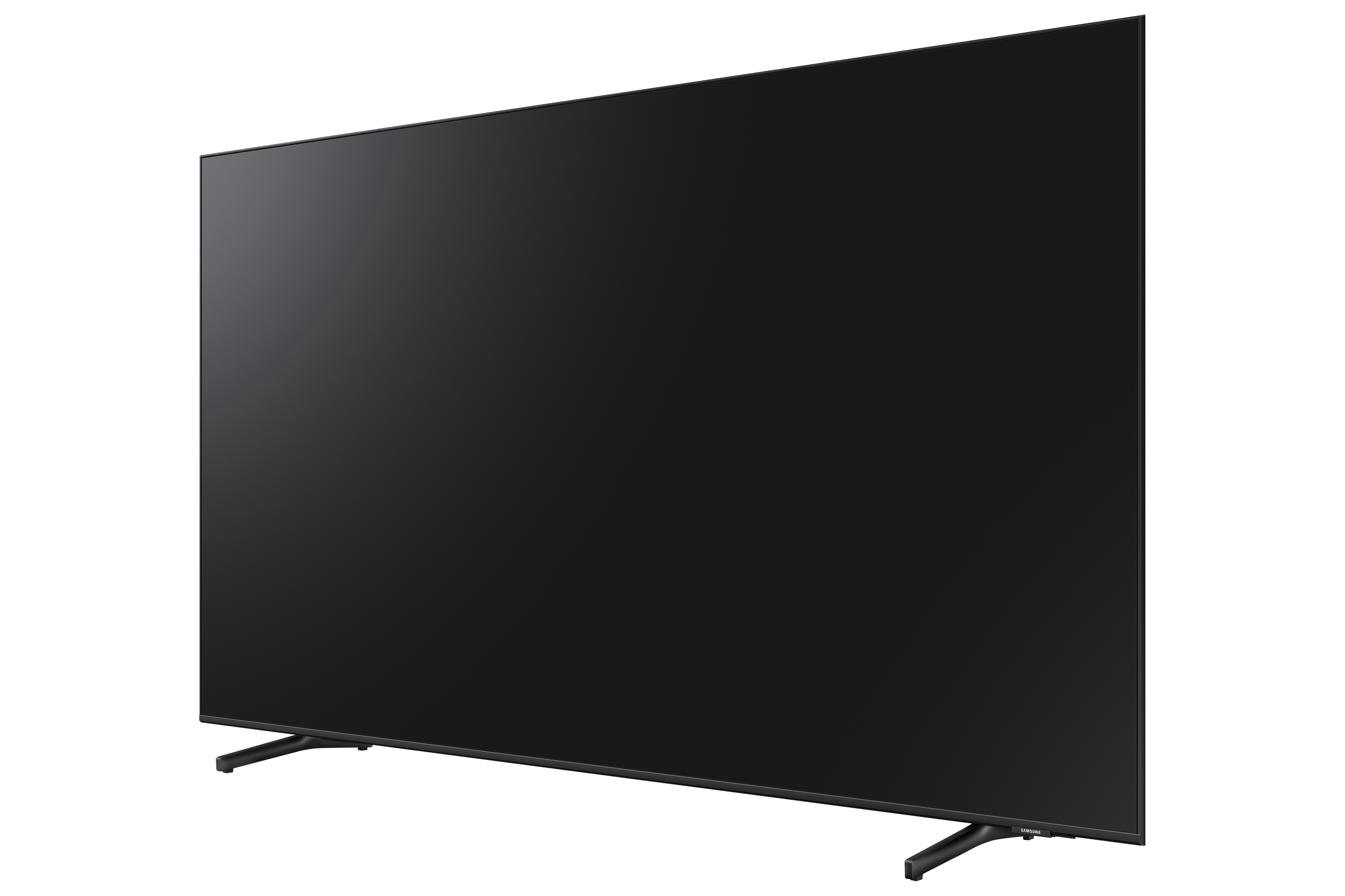 Una grande TV nera con un supporto minimo, vista da un'angolazione. Schermo nero.