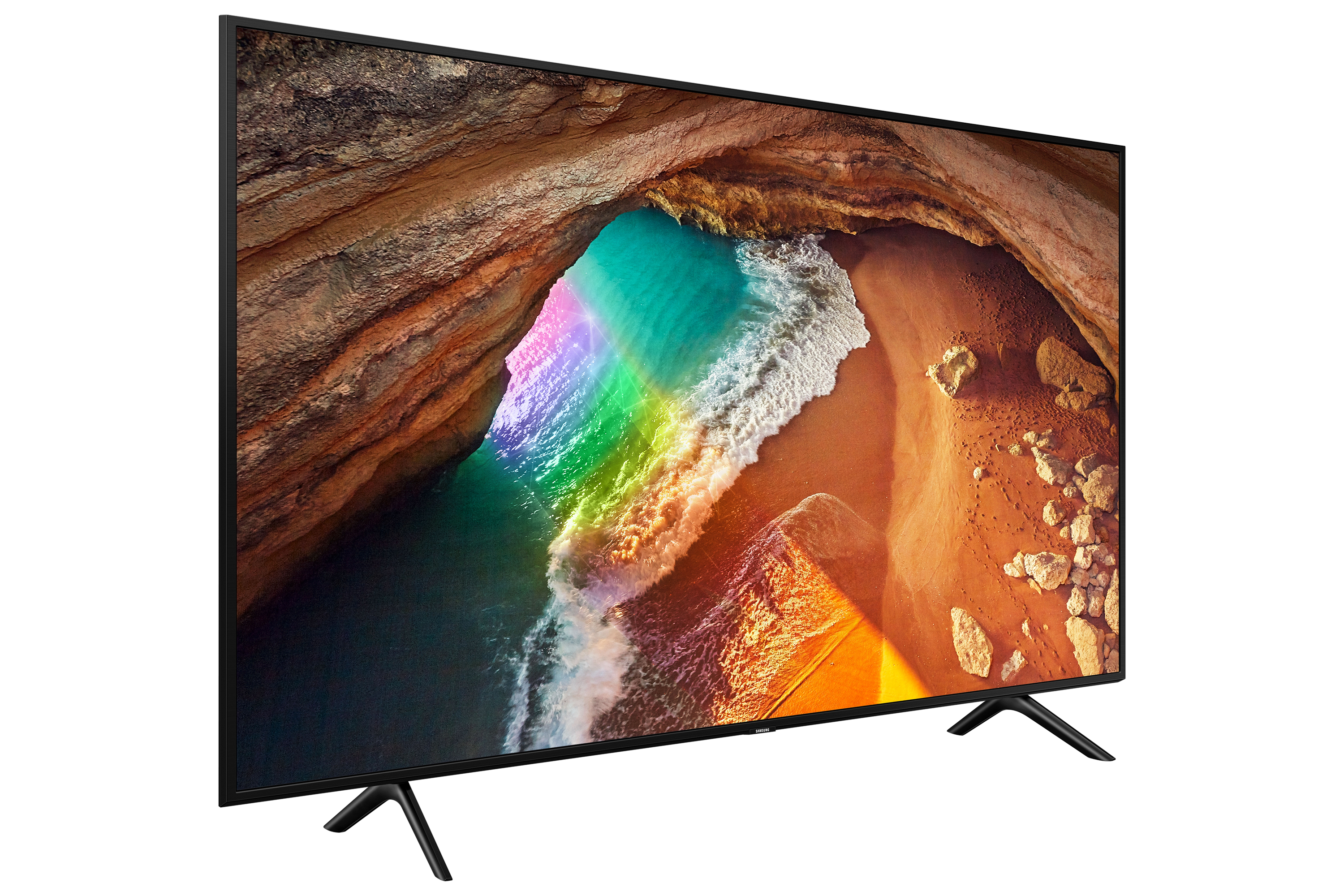 Schermo TV con scena di spiaggia, arcobaleno sull'acqua.