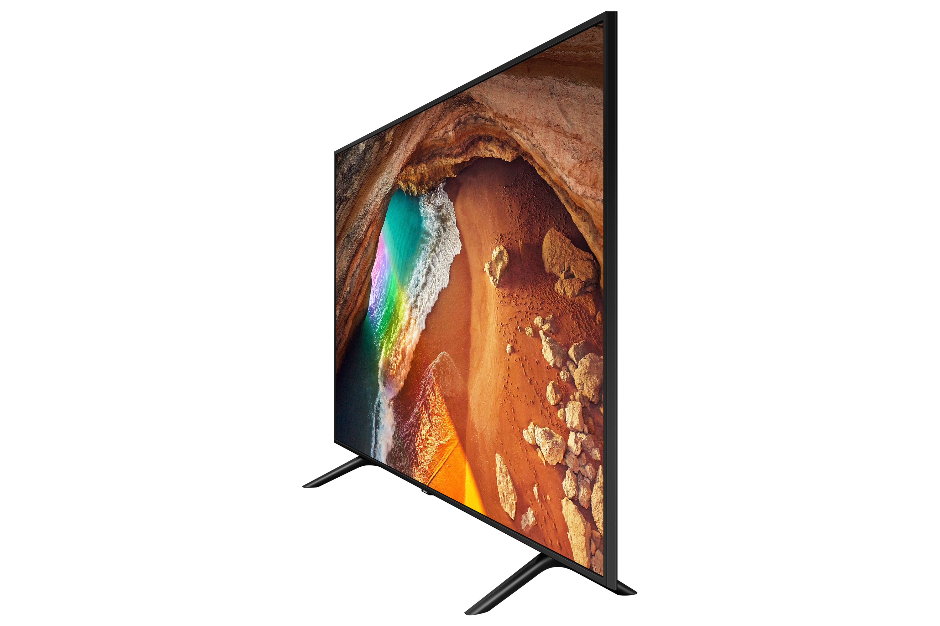 TV che mostra una scena di spiaggia con arcobaleno. Inclinato a destra su sfondo bianco.