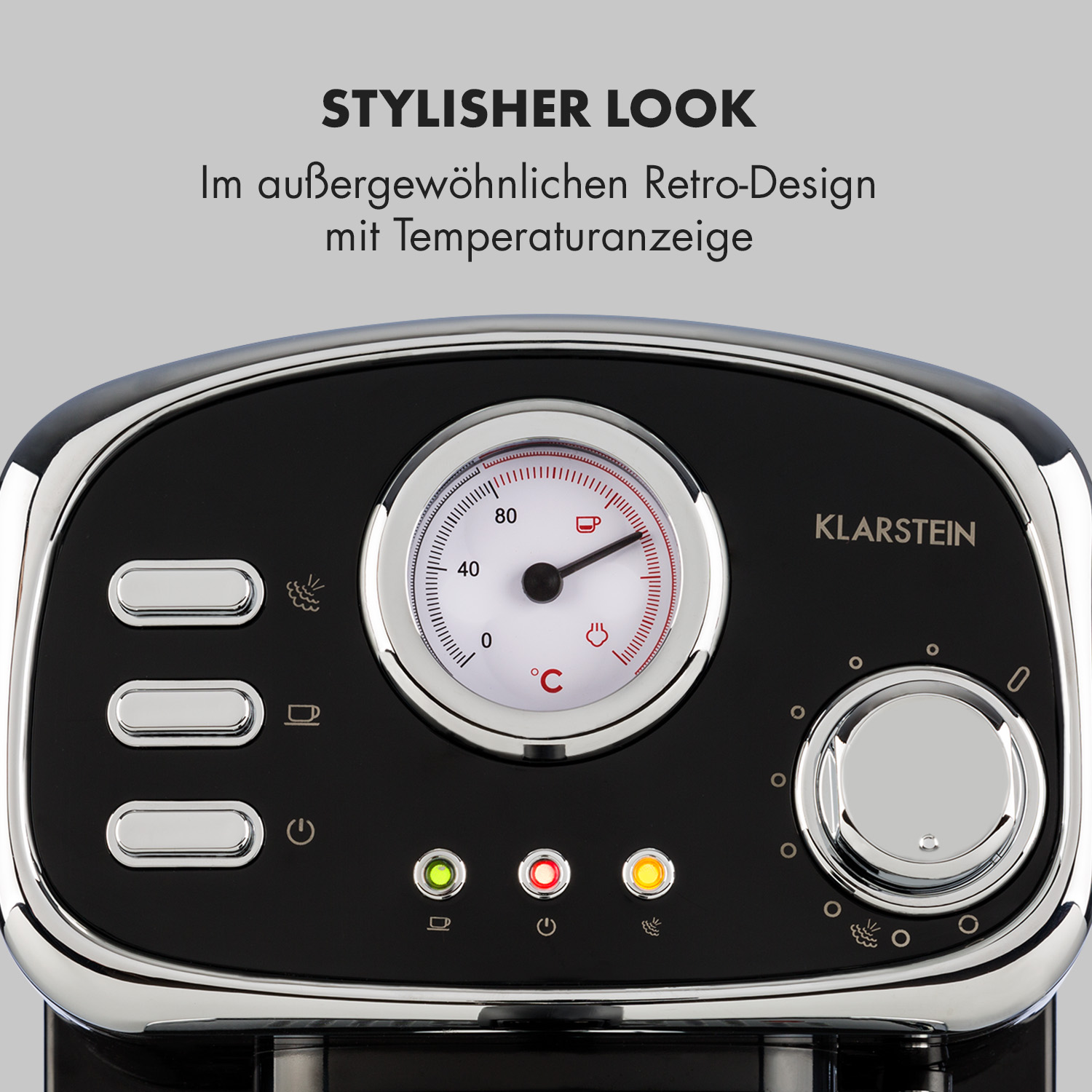 Eine Kaffeemaschine im Retro-Stil mit Temperaturanzeige und Knöpfen.