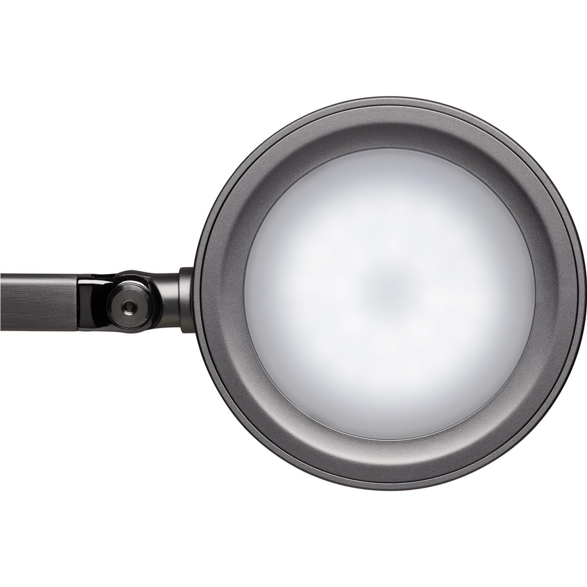 Una lampada rotonda grigio scuro con una luce brillante al centro.