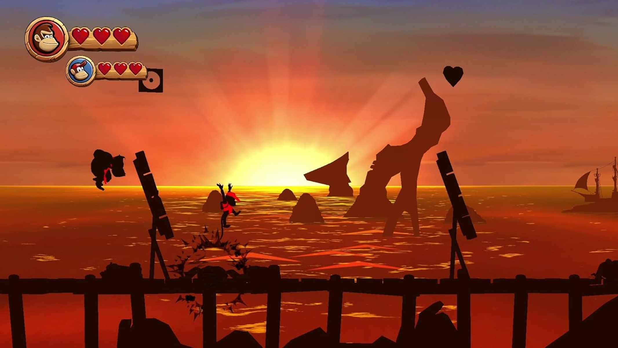 Scena z gry Donkey Kong z zachodem słońca i elementami.
